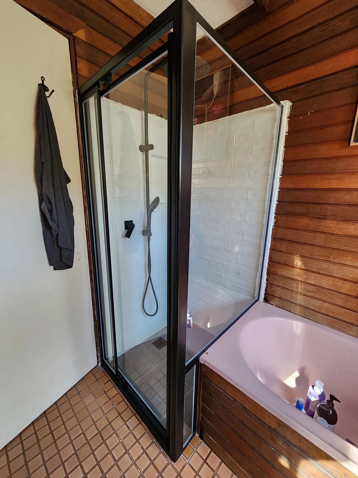 fully shower screen with black hardware installed in Woronora by Showerland