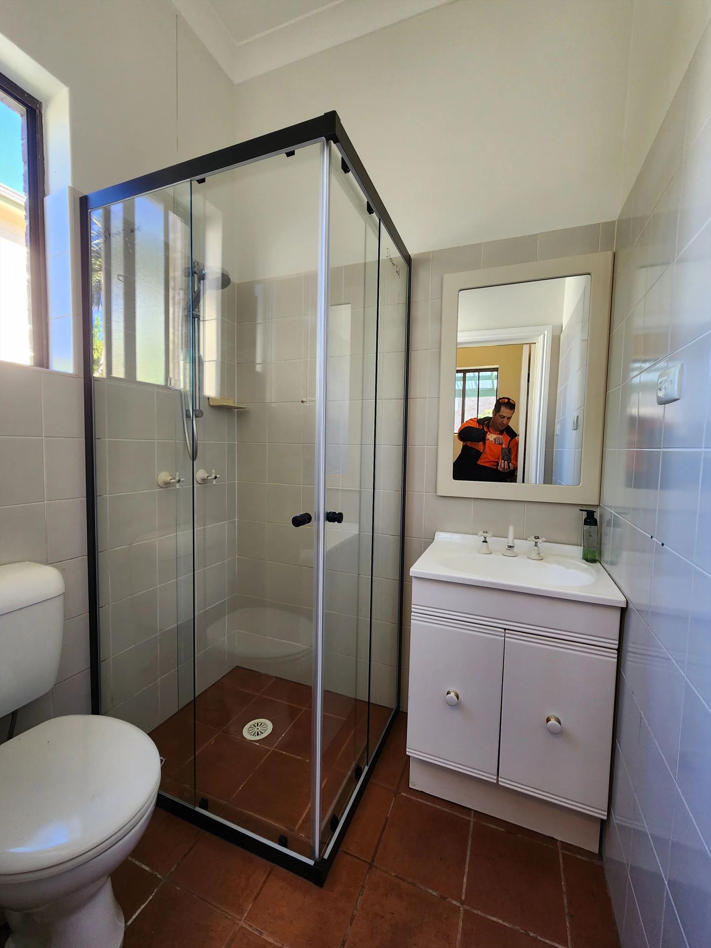 fully shower screen with white hardware installed in Ashfield by Showerland