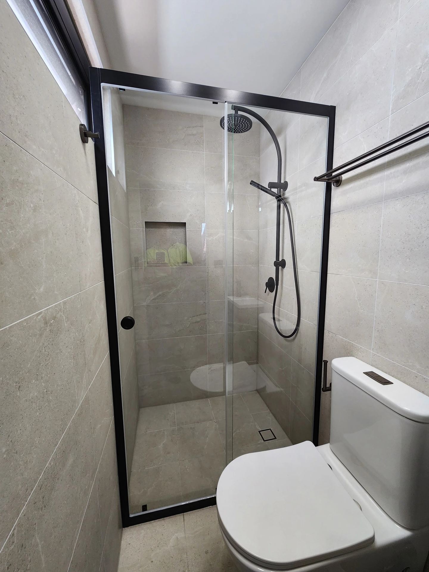 semi shower screen with black hardware installed in St Peters by Showerland
