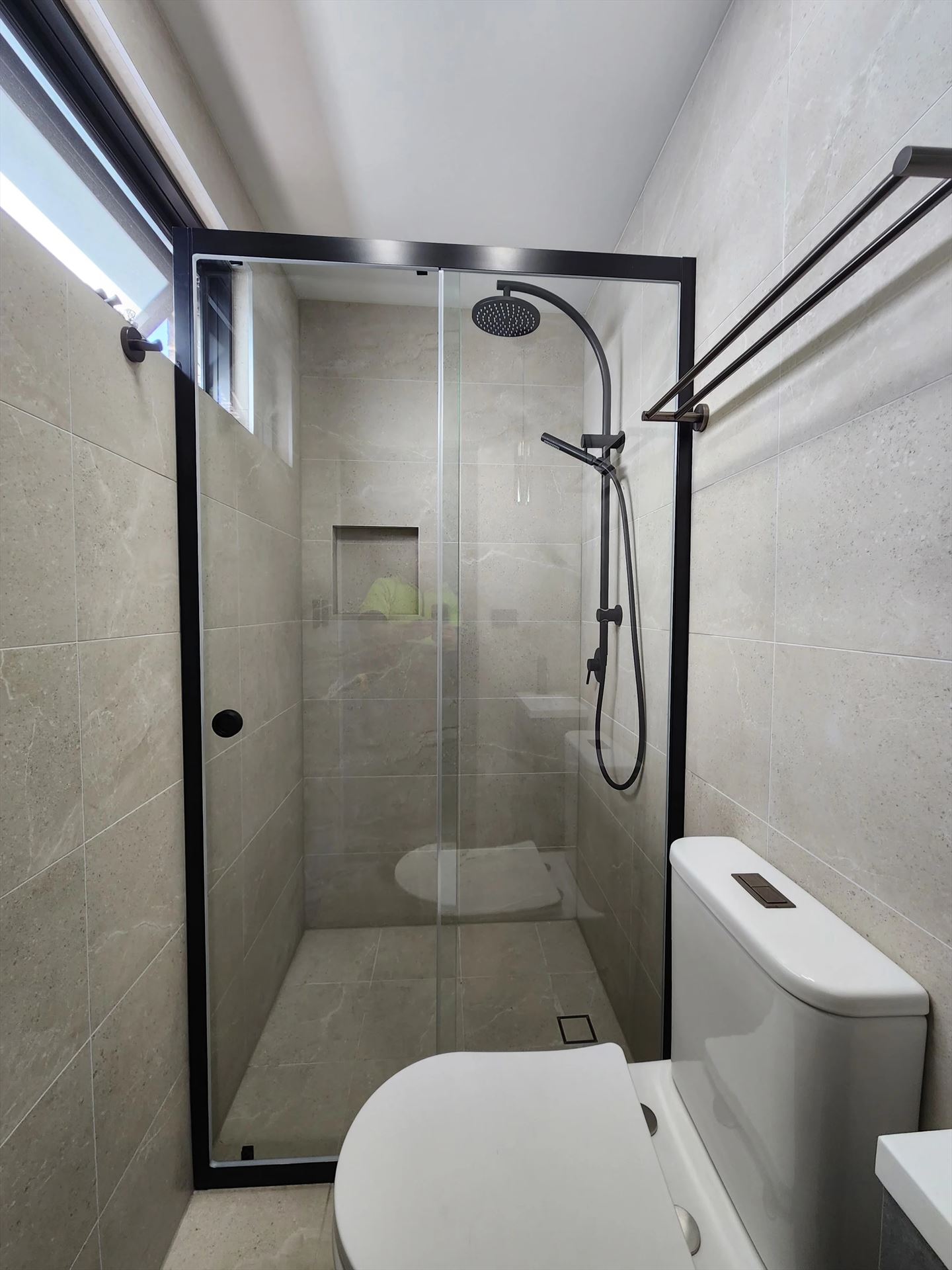 semi shower screen with black hardware installed in St Peters by Showerland