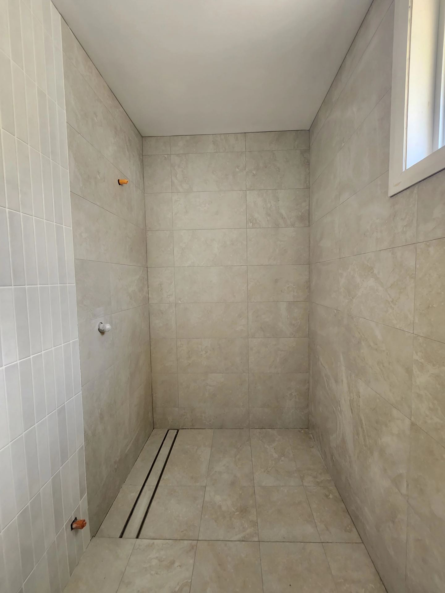 Bathroom before frameless shower screen install in Richmond