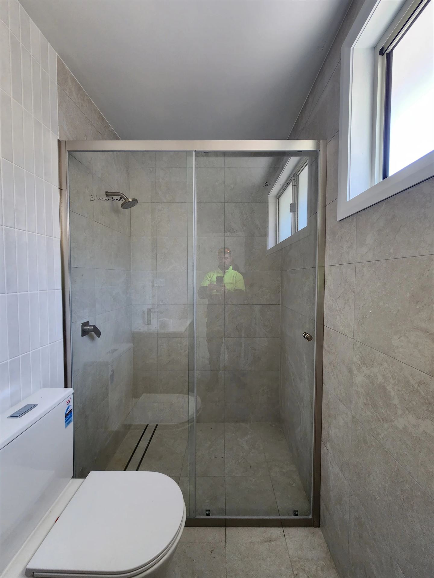 semi shower screen with chrome hardware installed in Richmond by Showerland