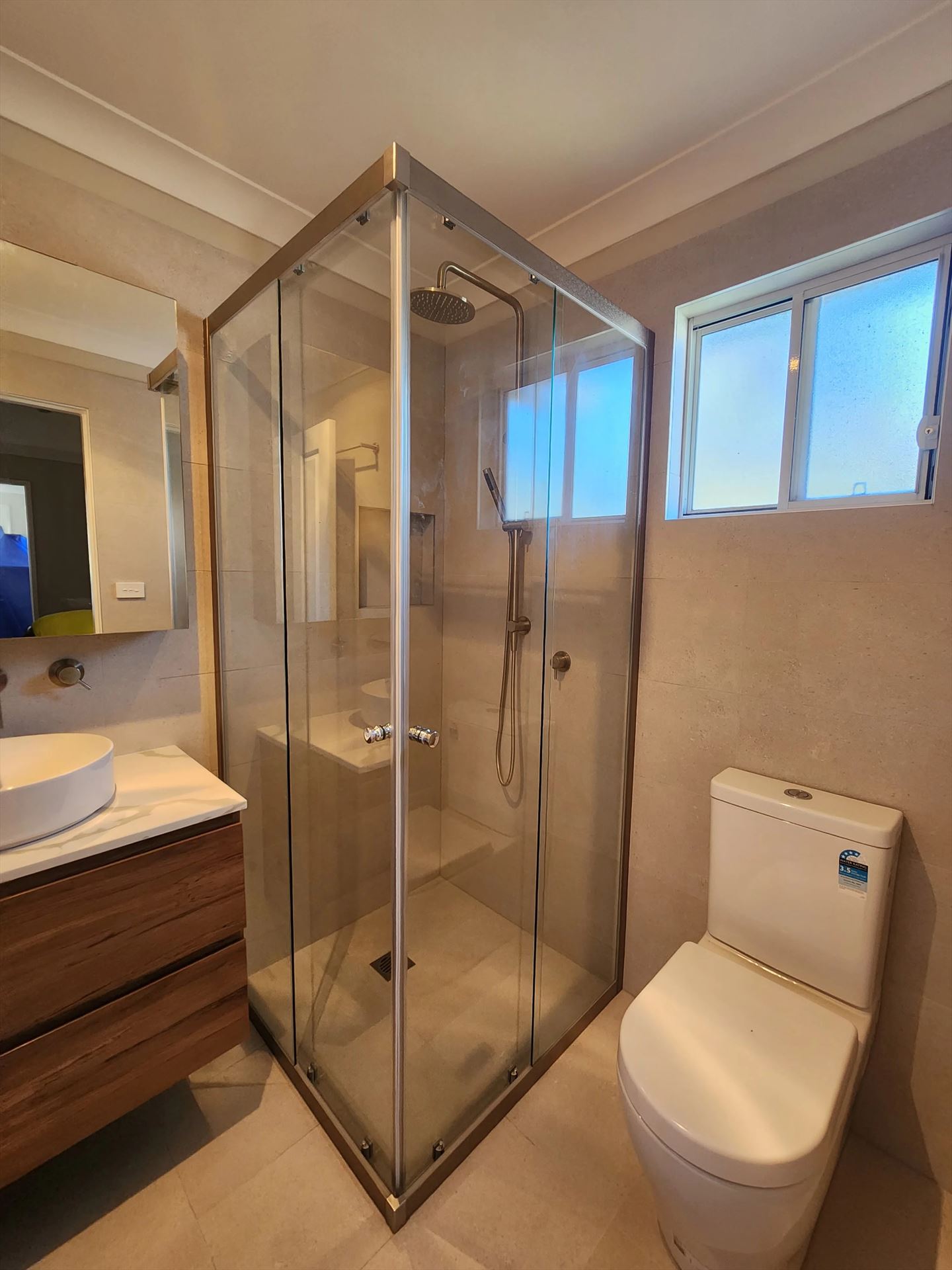 semi shower screen with chrome hardware installed in Oyster Bay by Showerland