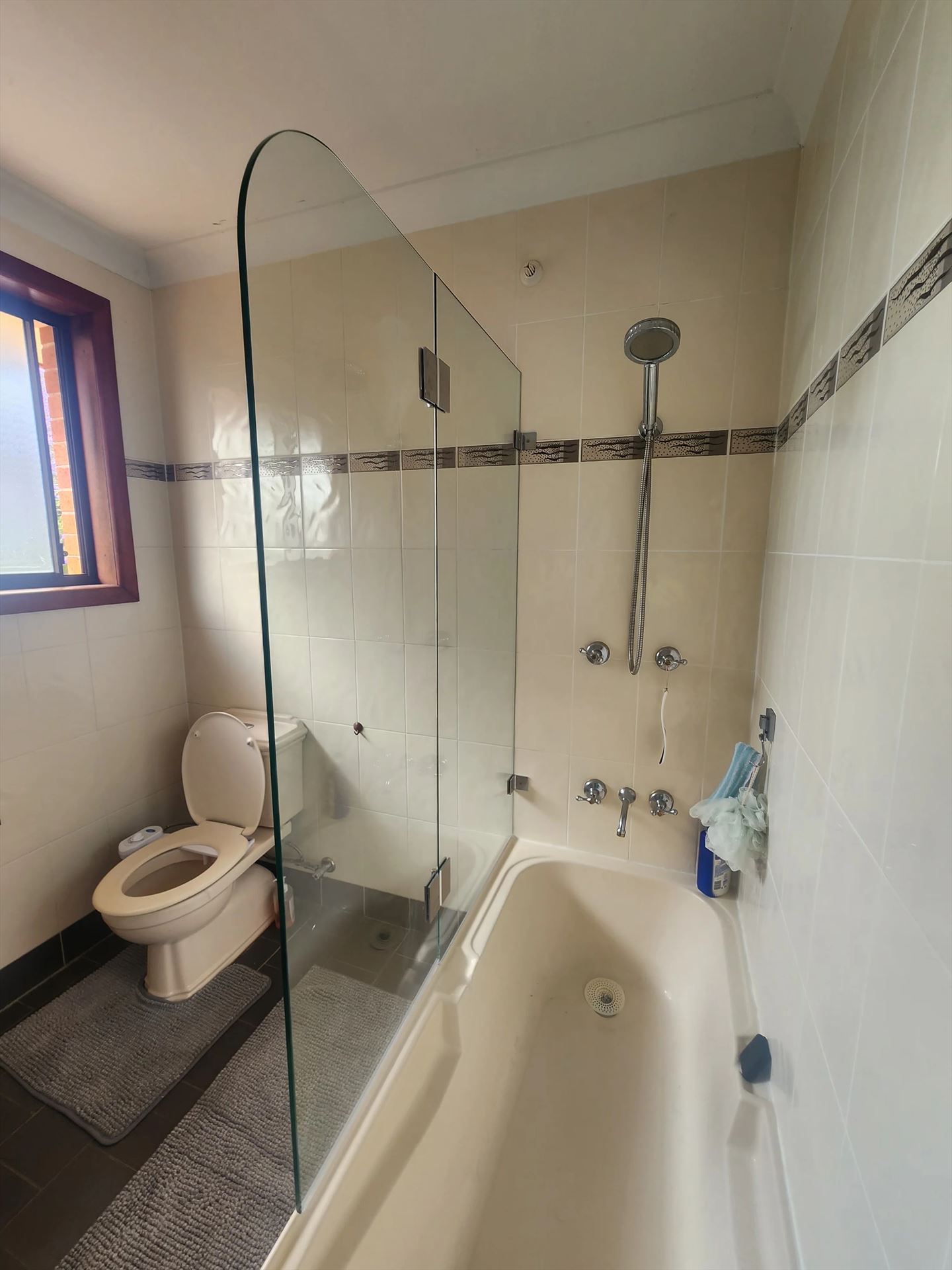 frameless shower screen with chrome hardware installed in Lalor Park by Showerland