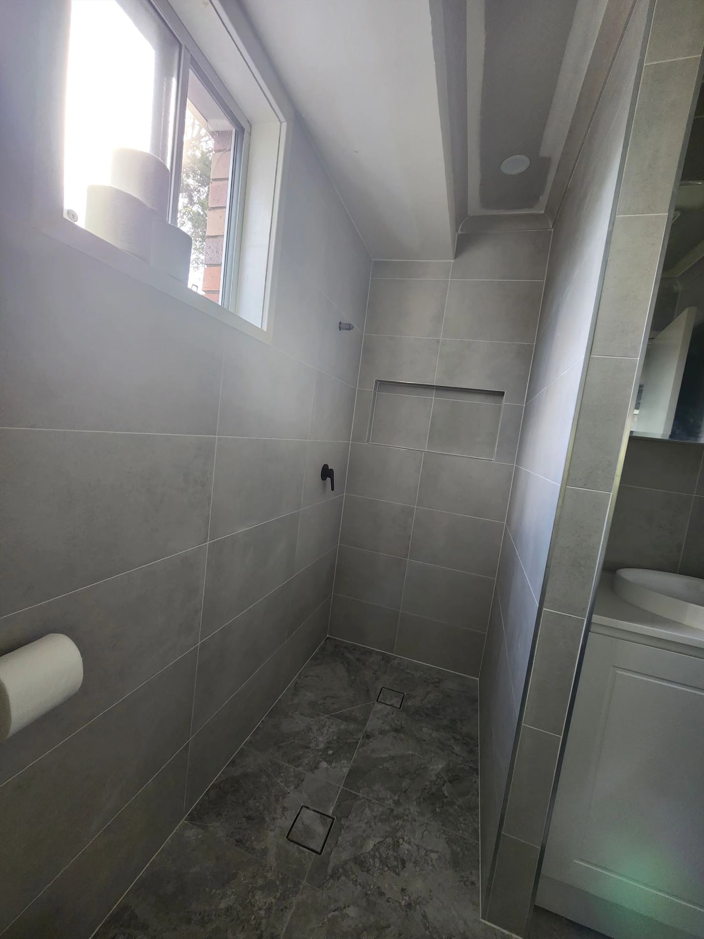 Bathroom before frameless shower screen install in Erskine Park