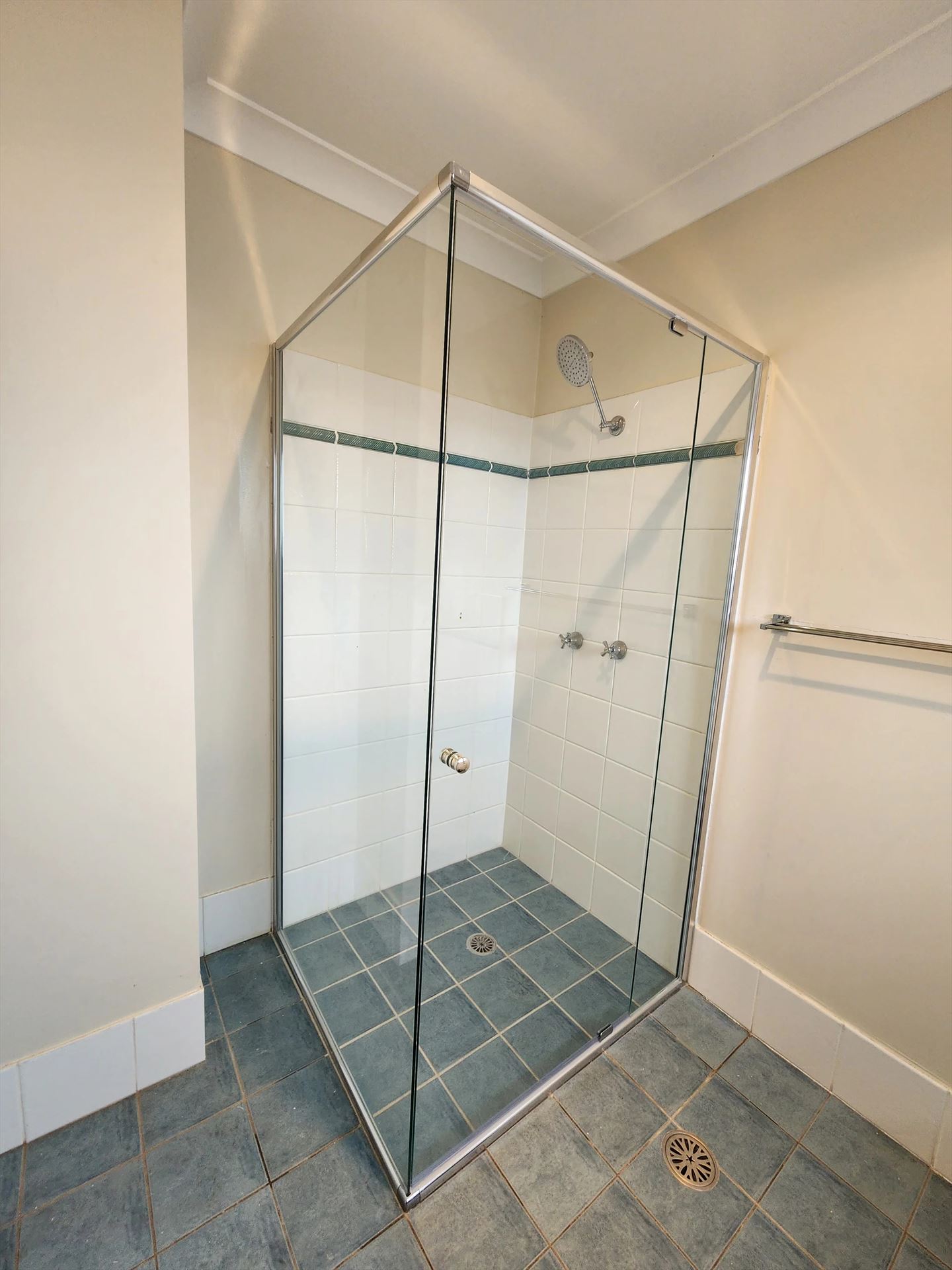 semi shower screen with chrome hardware installed in Kellyville by Showerland