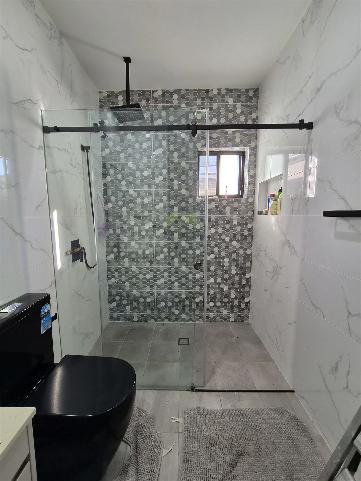 frameless shower screen with chrome hardware installed in Marsden Park by Showerland