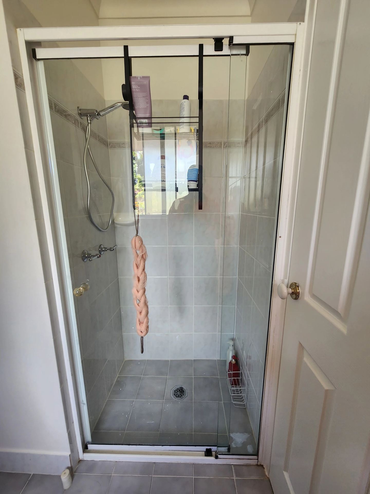 semi shower screen with white hardware installed in Hornsby by Showerland