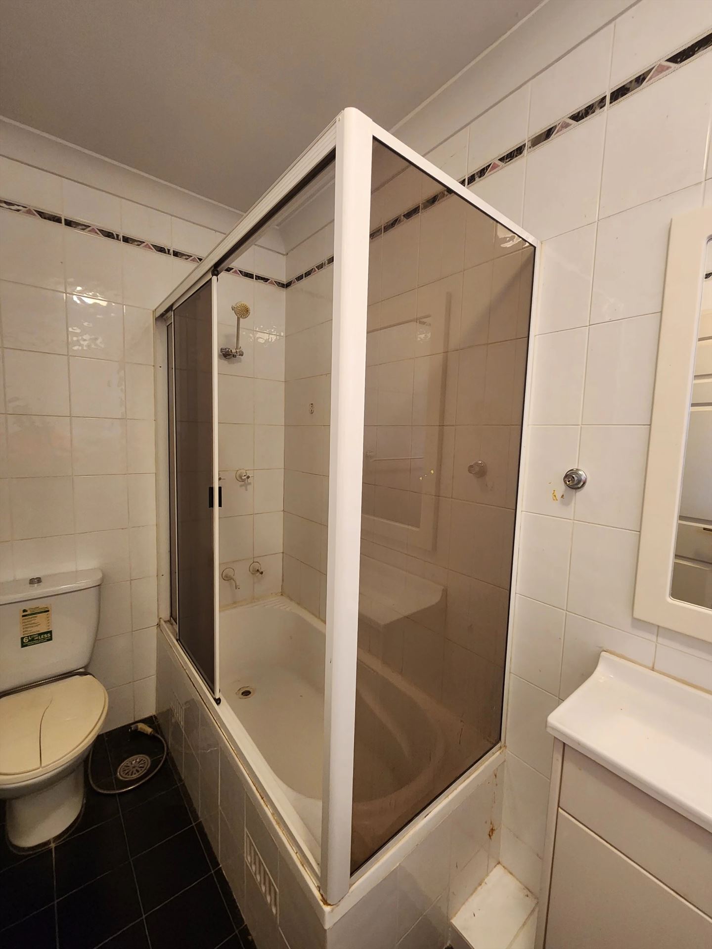 fully shower screen with white hardware installed in Artarmon by Showerland
