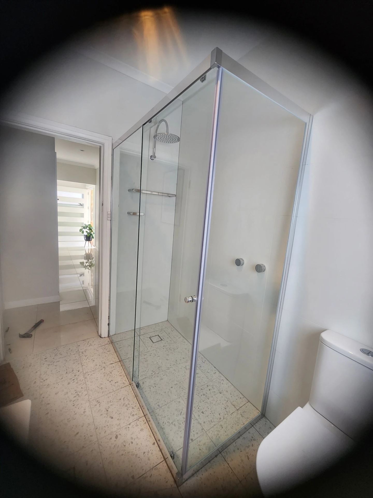 semi shower screen with chrome hardware installed in Freshwater by Showerland