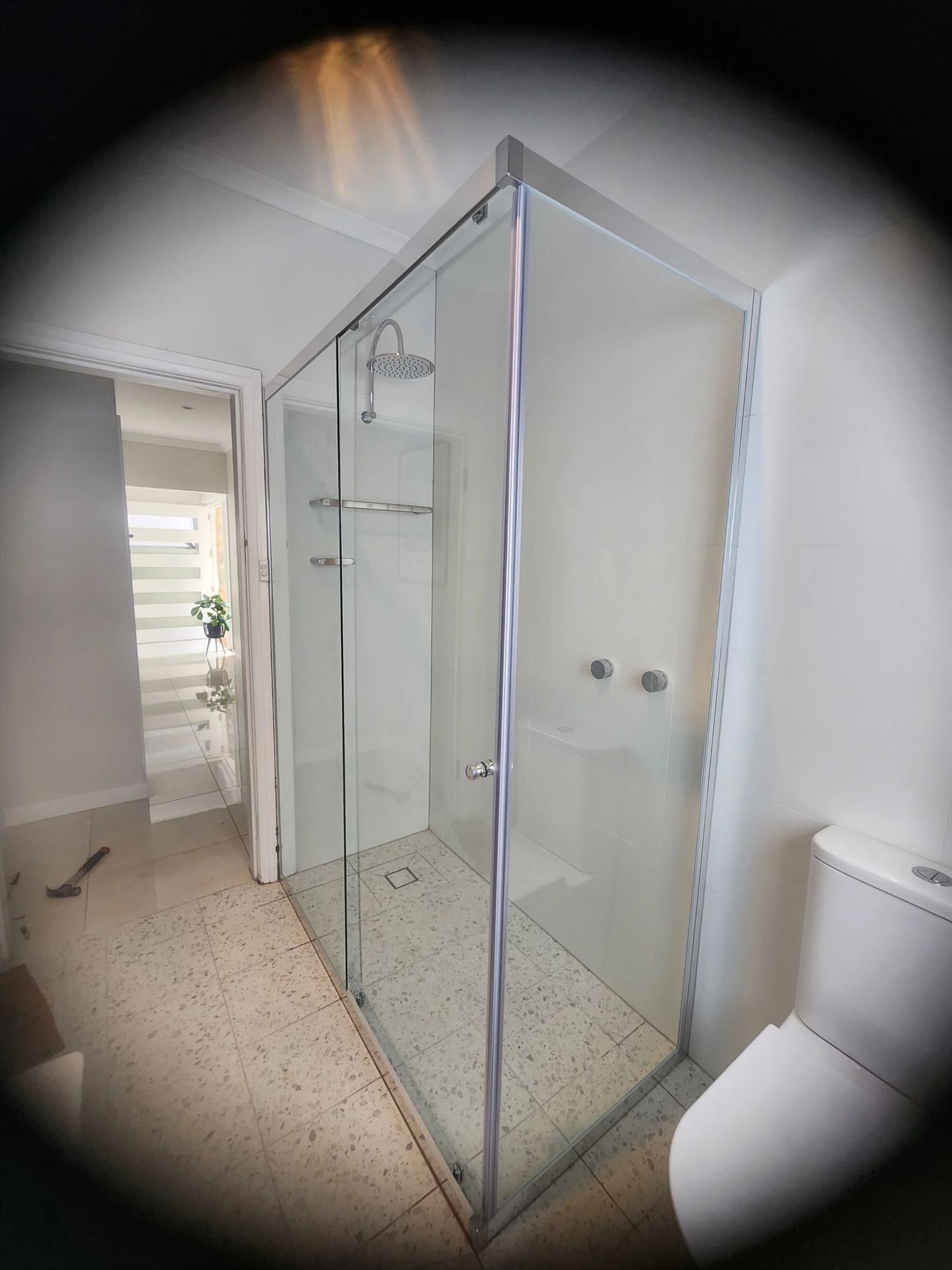 semi shower screen with chrome hardware installed in Freshwater by Showerland