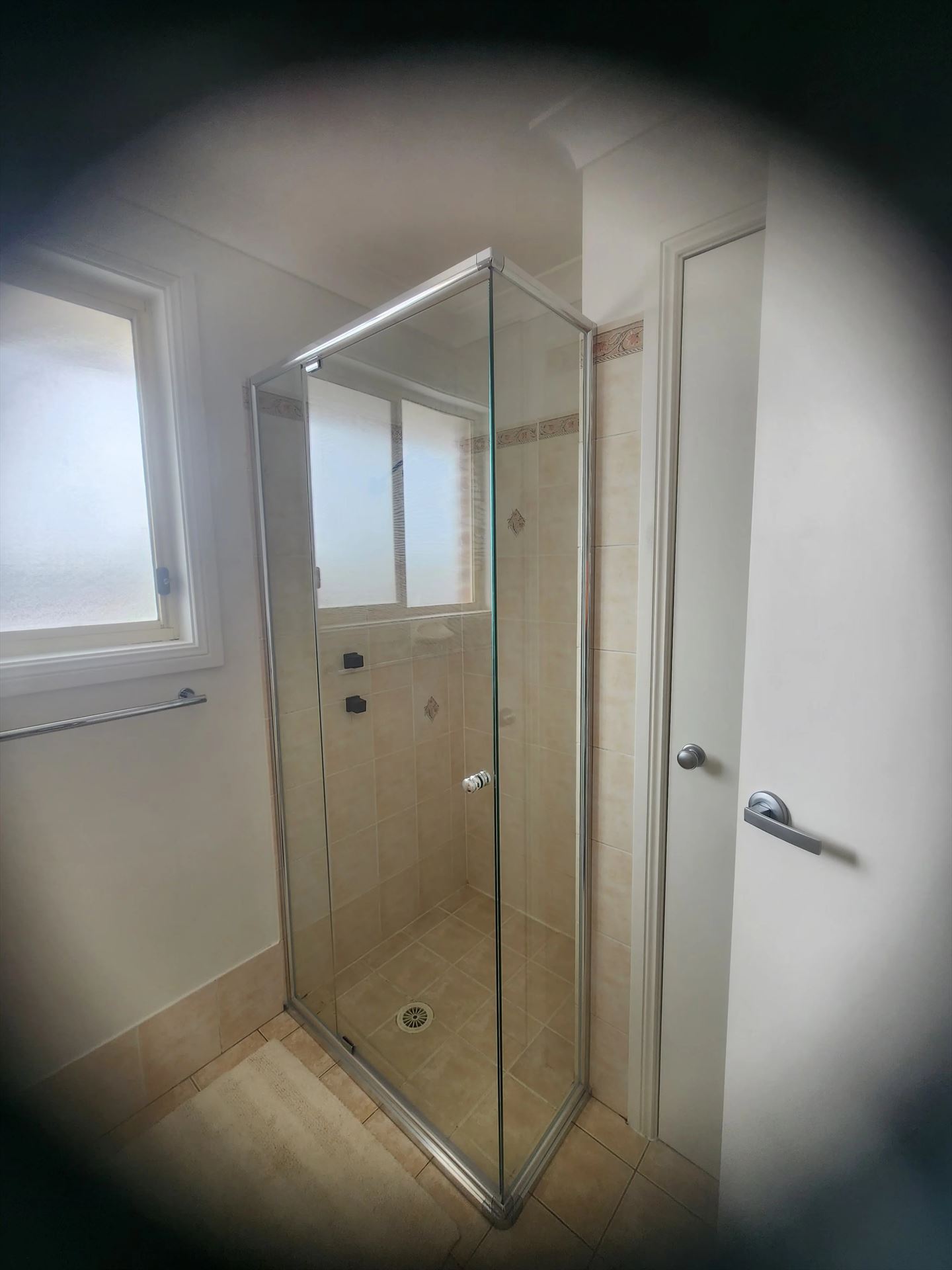 semi shower screen with chrome hardware installed in Glenwood by Showerland
