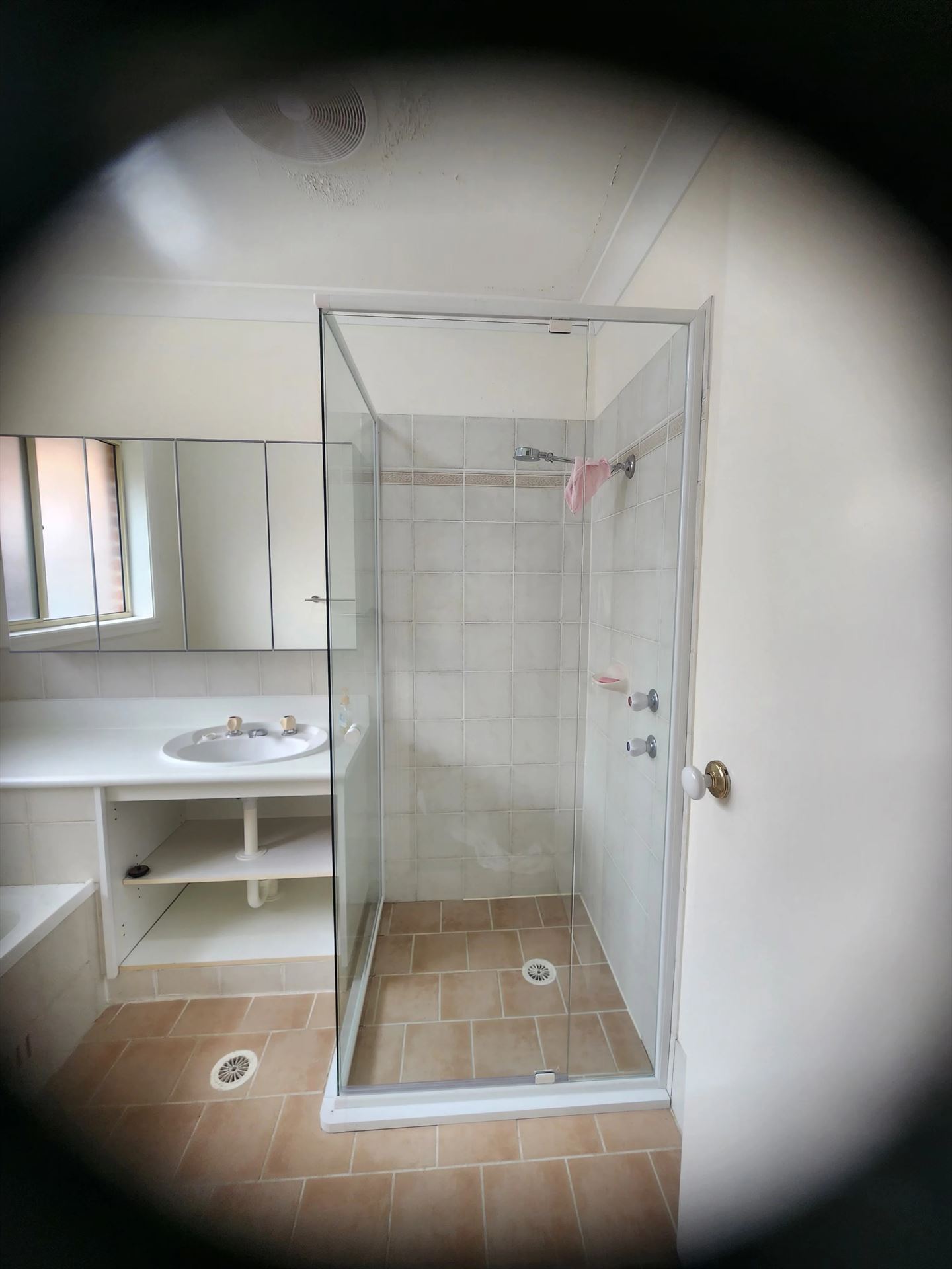 semi shower screen with chrome hardware installed in Stanhope Gardens by Showerland