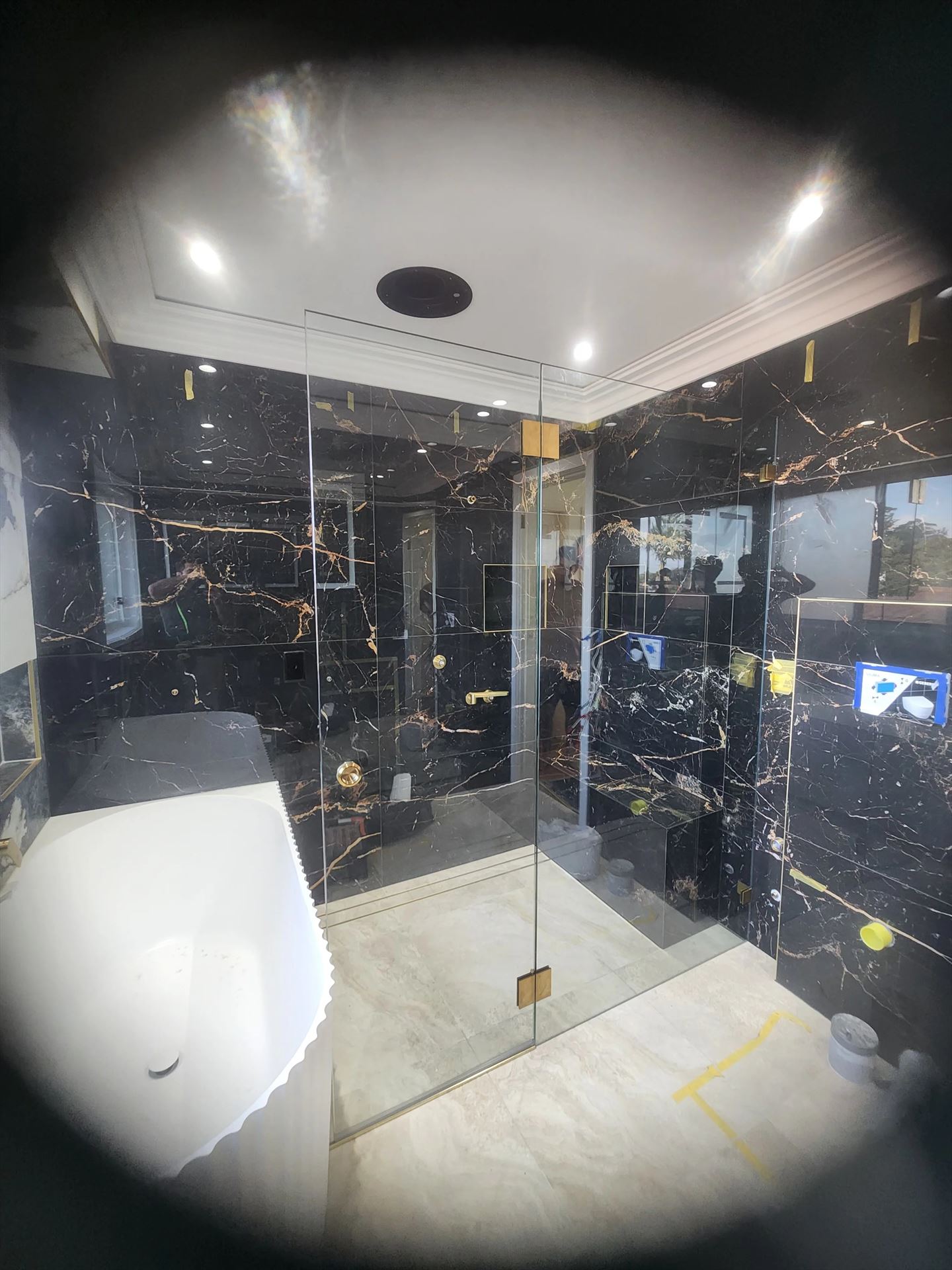 frameless shower screen with gold hardware installed in Guildford West by Showerland