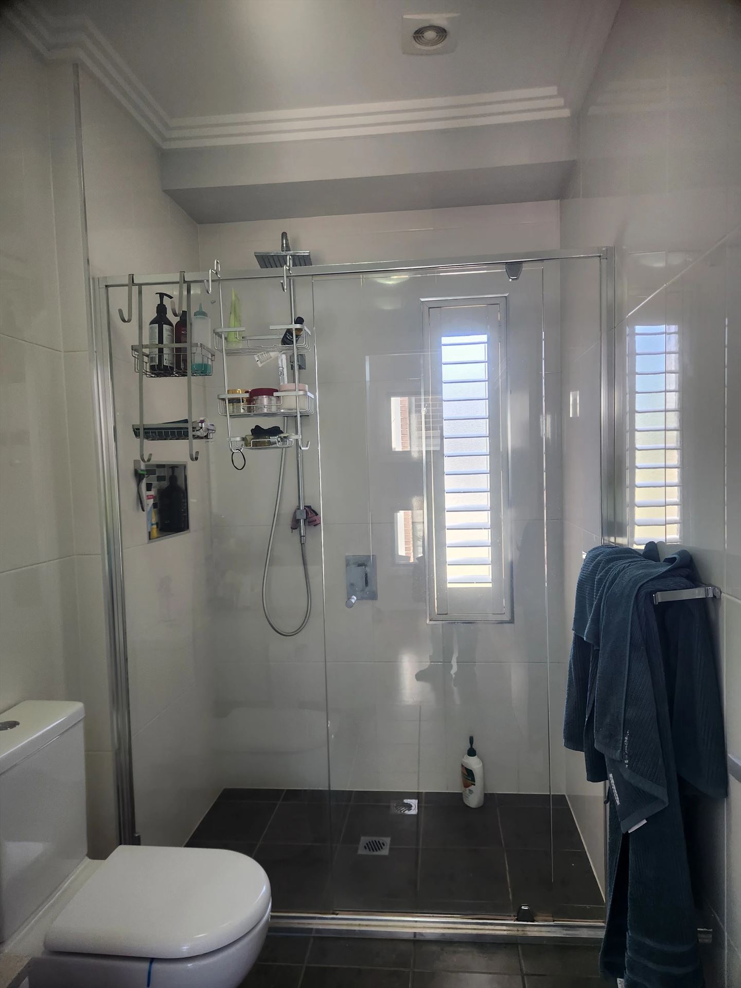 semi shower screen with chrome hardware installed in Kellyville by Showerland