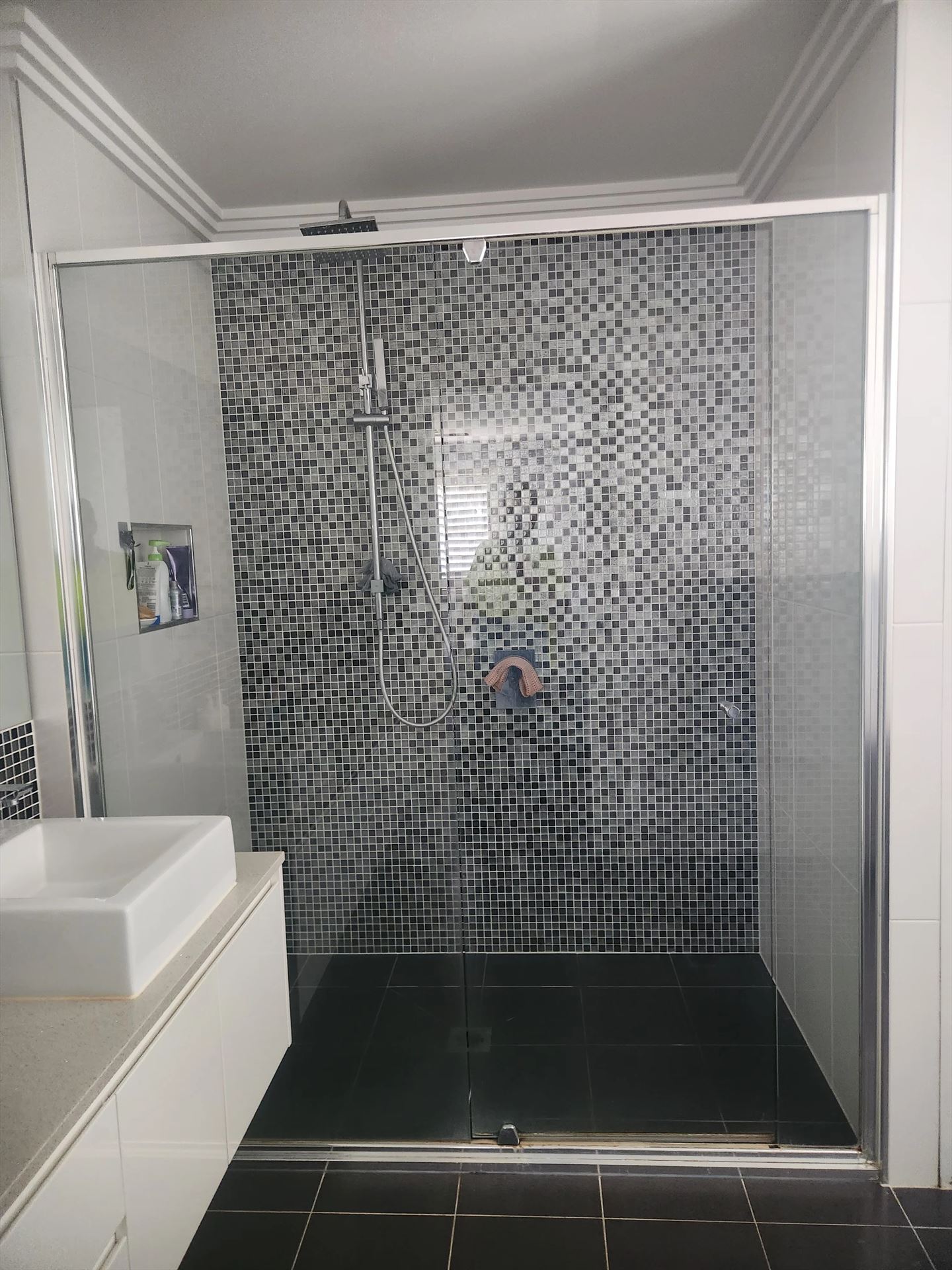 semi shower screen with chrome hardware installed in Kellyville by Showerland