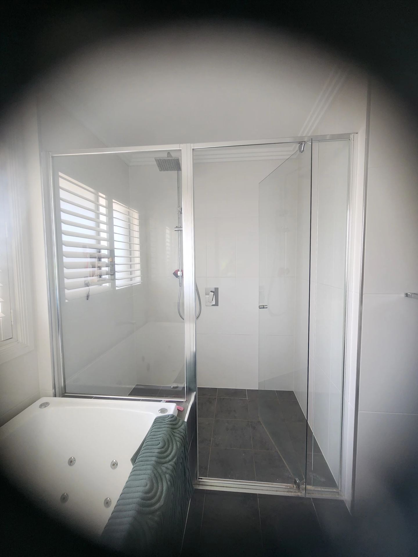 semi shower screen with chrome hardware installed in Kellyville by Showerland