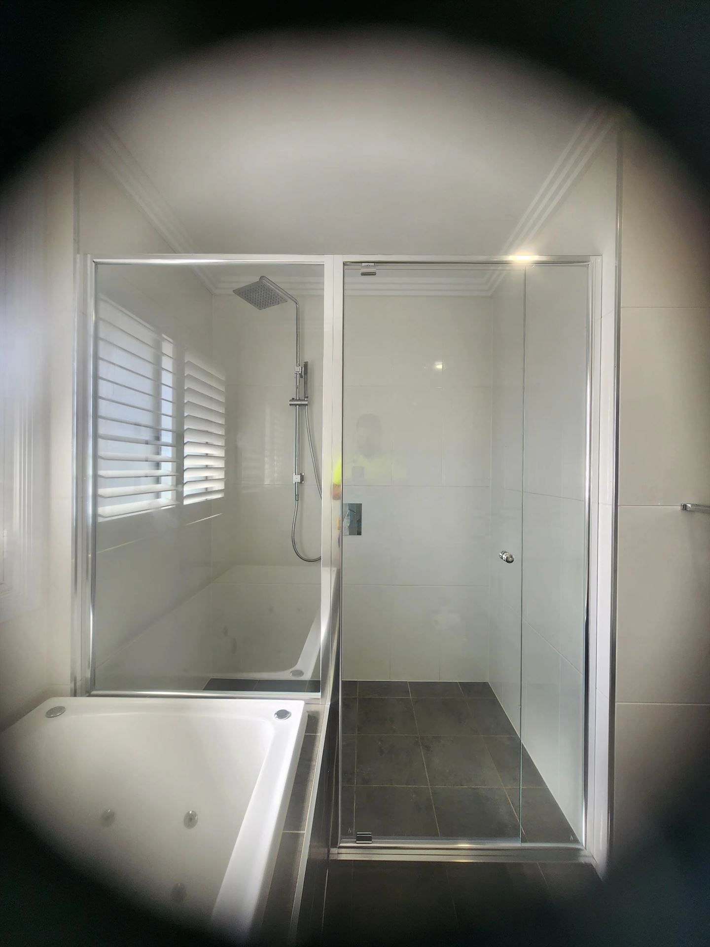 semi shower screen with chrome hardware installed in Kellyville by Showerland