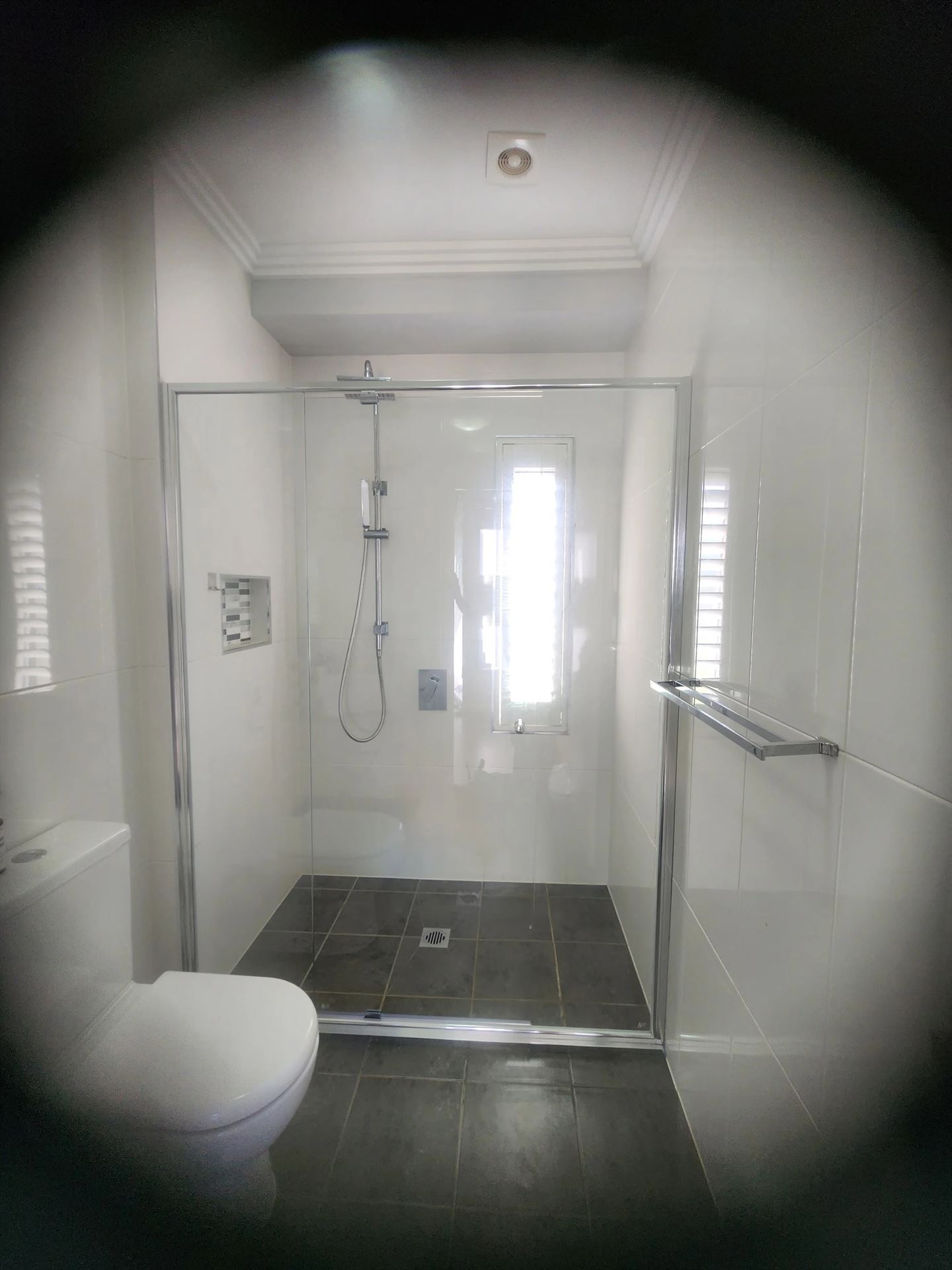 semi shower screen with chrome hardware installed in Kellyville by Showerland