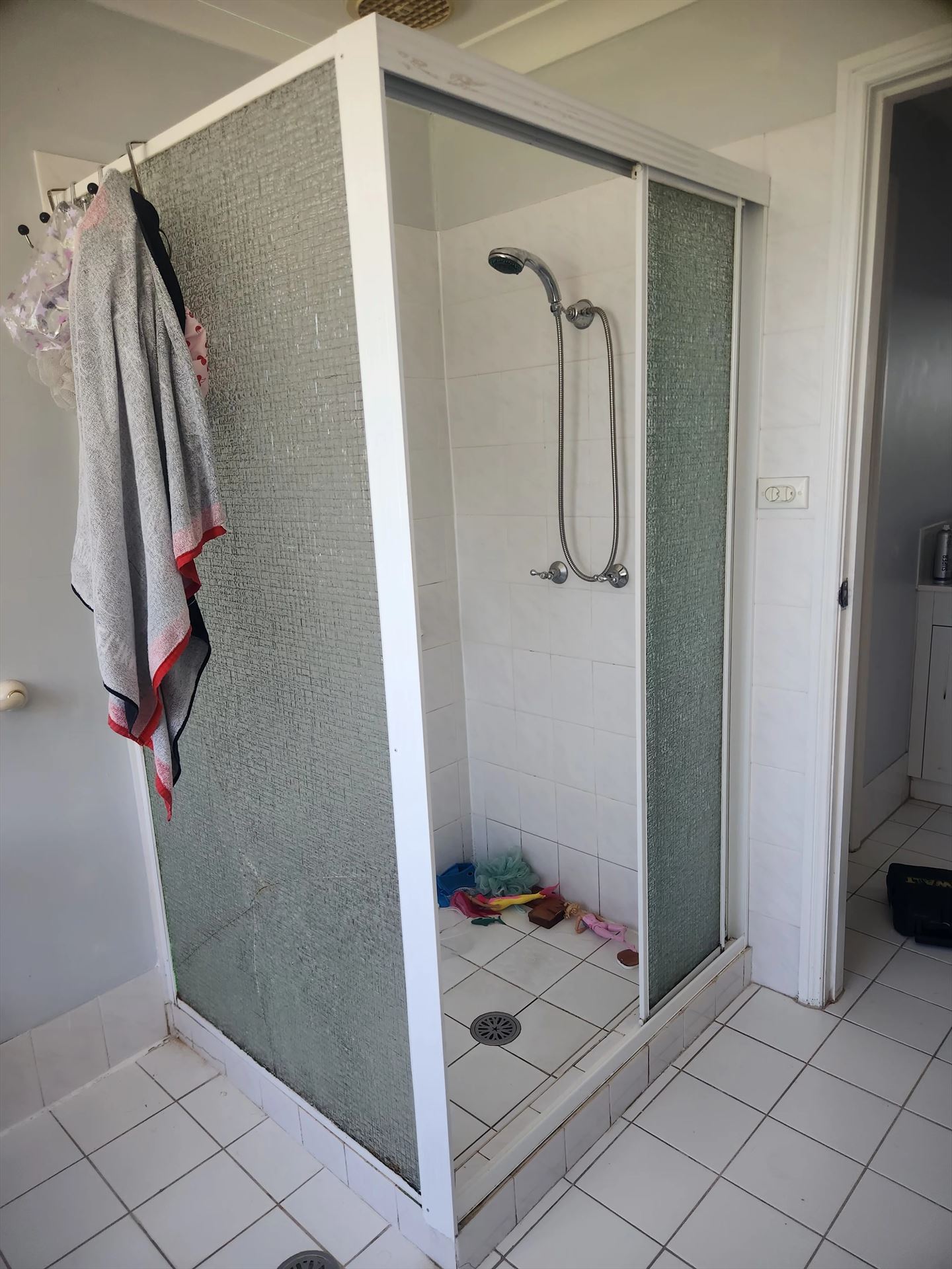 fully shower screen with white hardware installed in Quakers Hill by Showerland