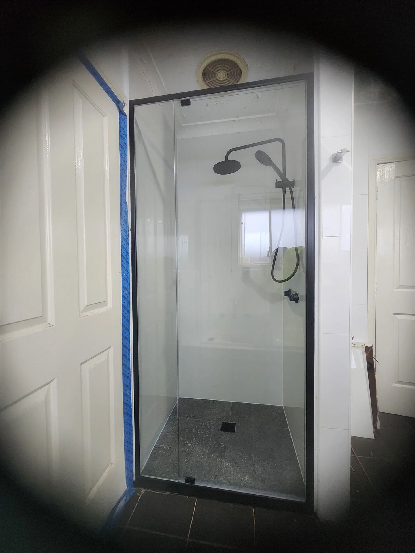 semi shower screen with black hardware installed in Greystanes by Showerland