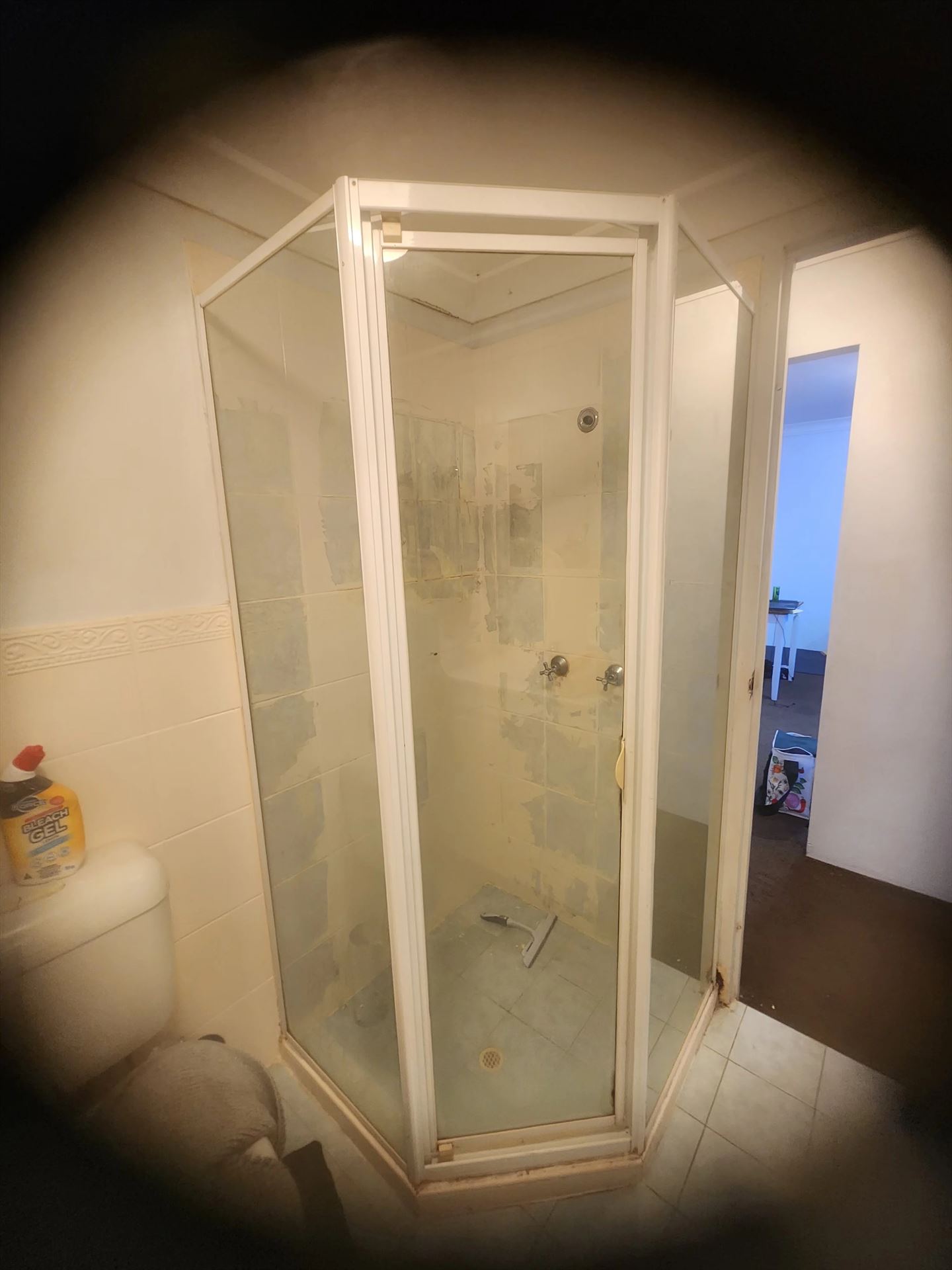fully shower screen with white hardware installed in Granville by Showerland