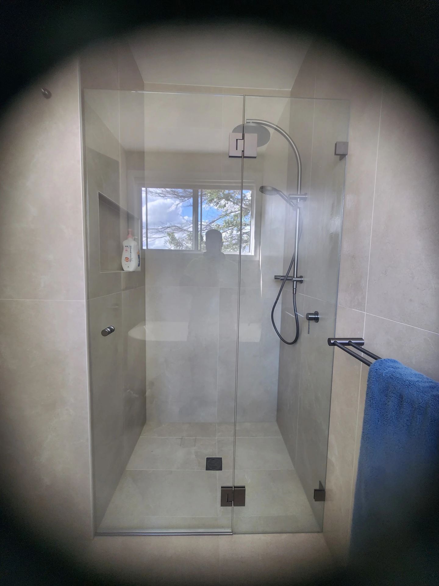 frameless shower screen with chrome hardware installed in Lilli Pilli by Showerland