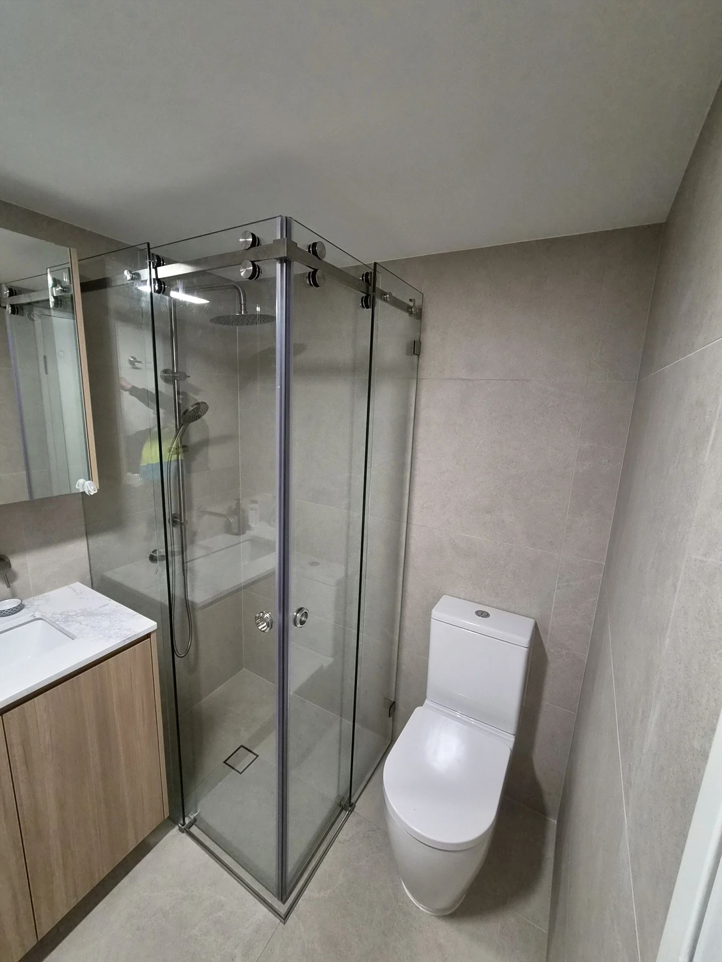 frameless shower screen with chrome hardware installed in Liberty Grove by Showerland