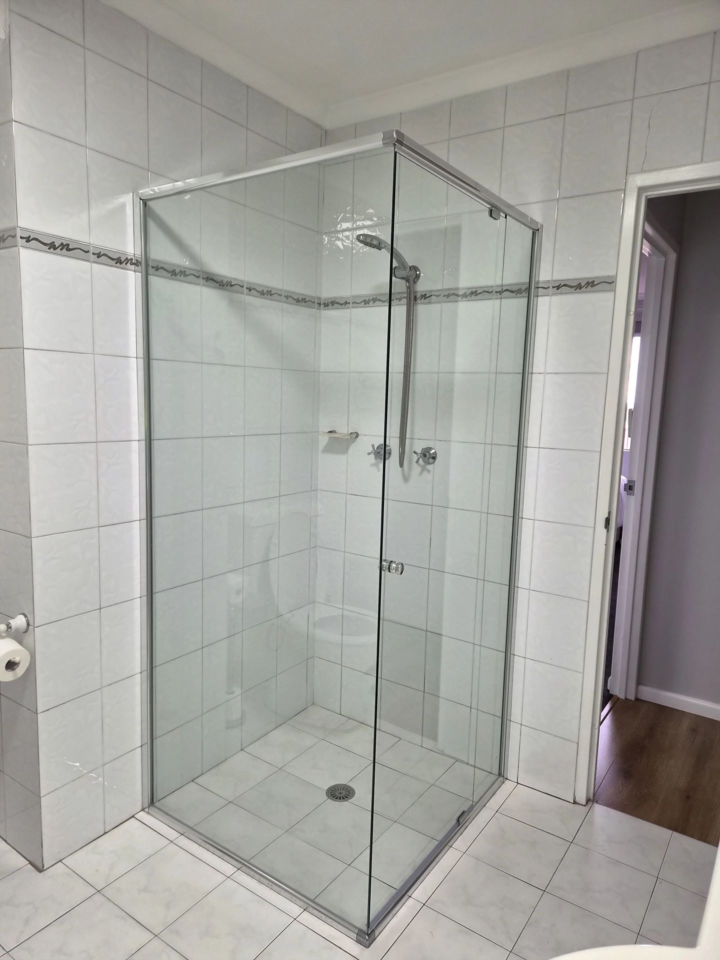 semi shower screen with chrome hardware installed in Wollstonecraft by Showerland