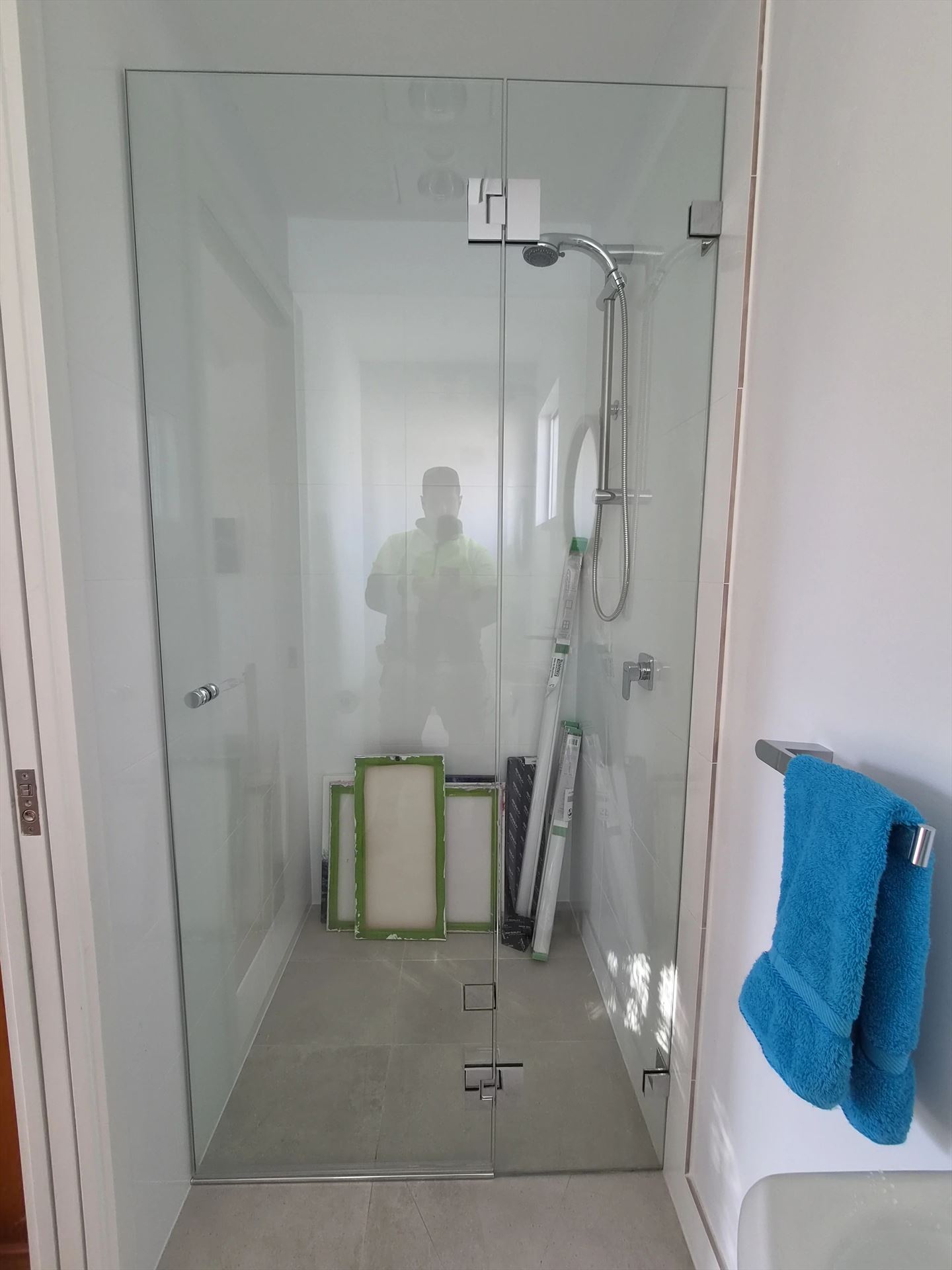 frameless shower screen with chrome hardware installed in Kings Langley by Showerland