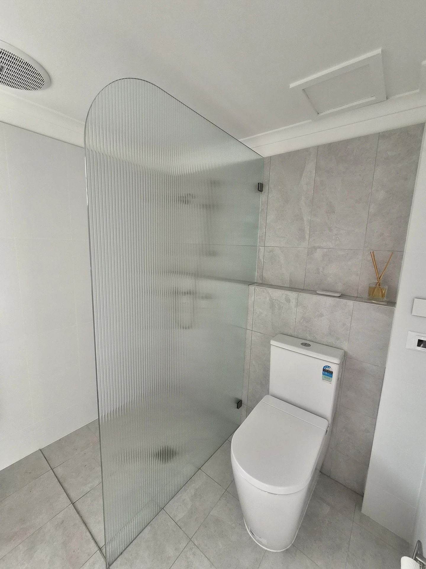 frameless shower screen with chrome hardware installed in Engadine by Showerland