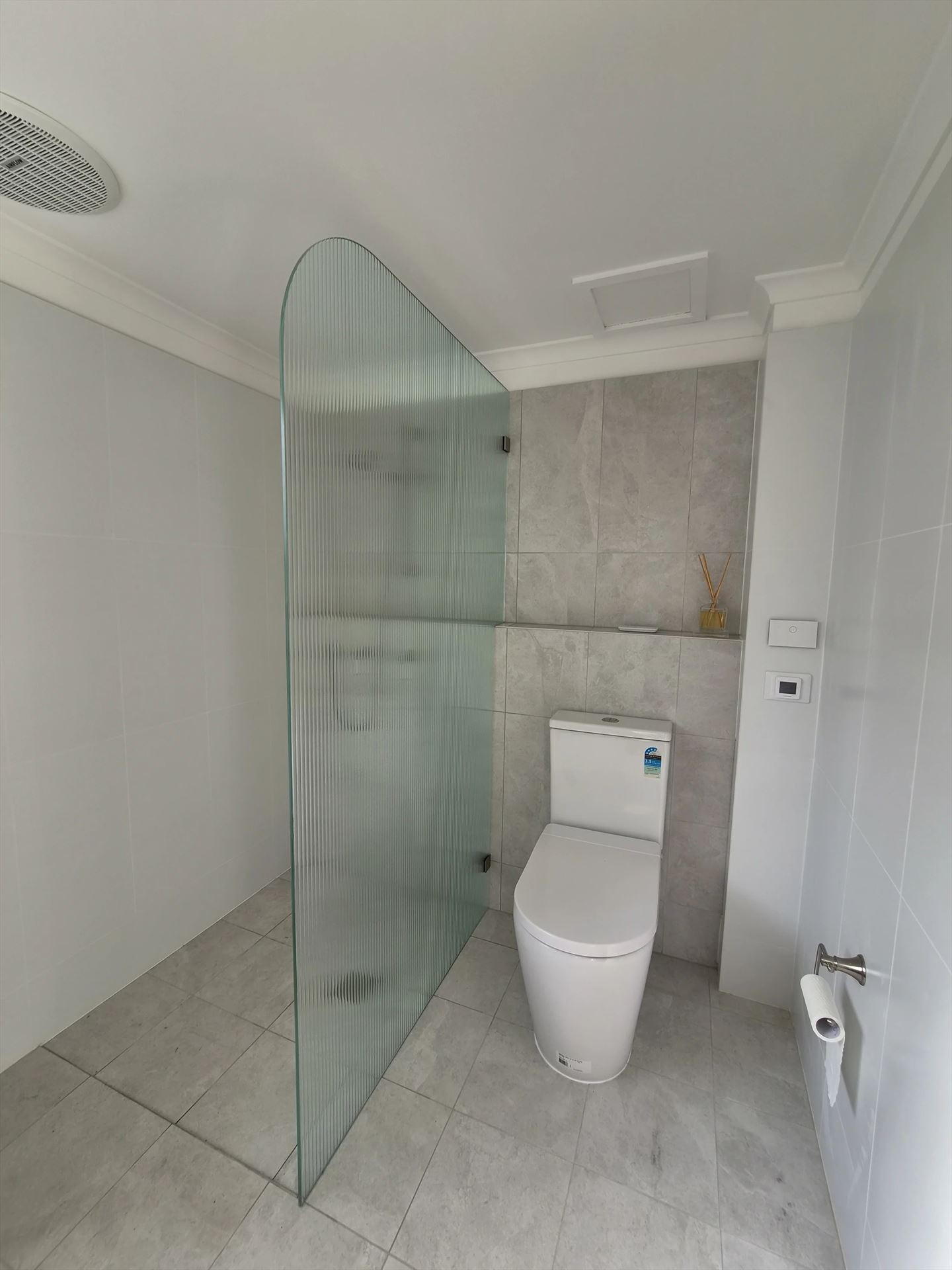 frameless shower screen with chrome hardware installed in Engadine by Showerland