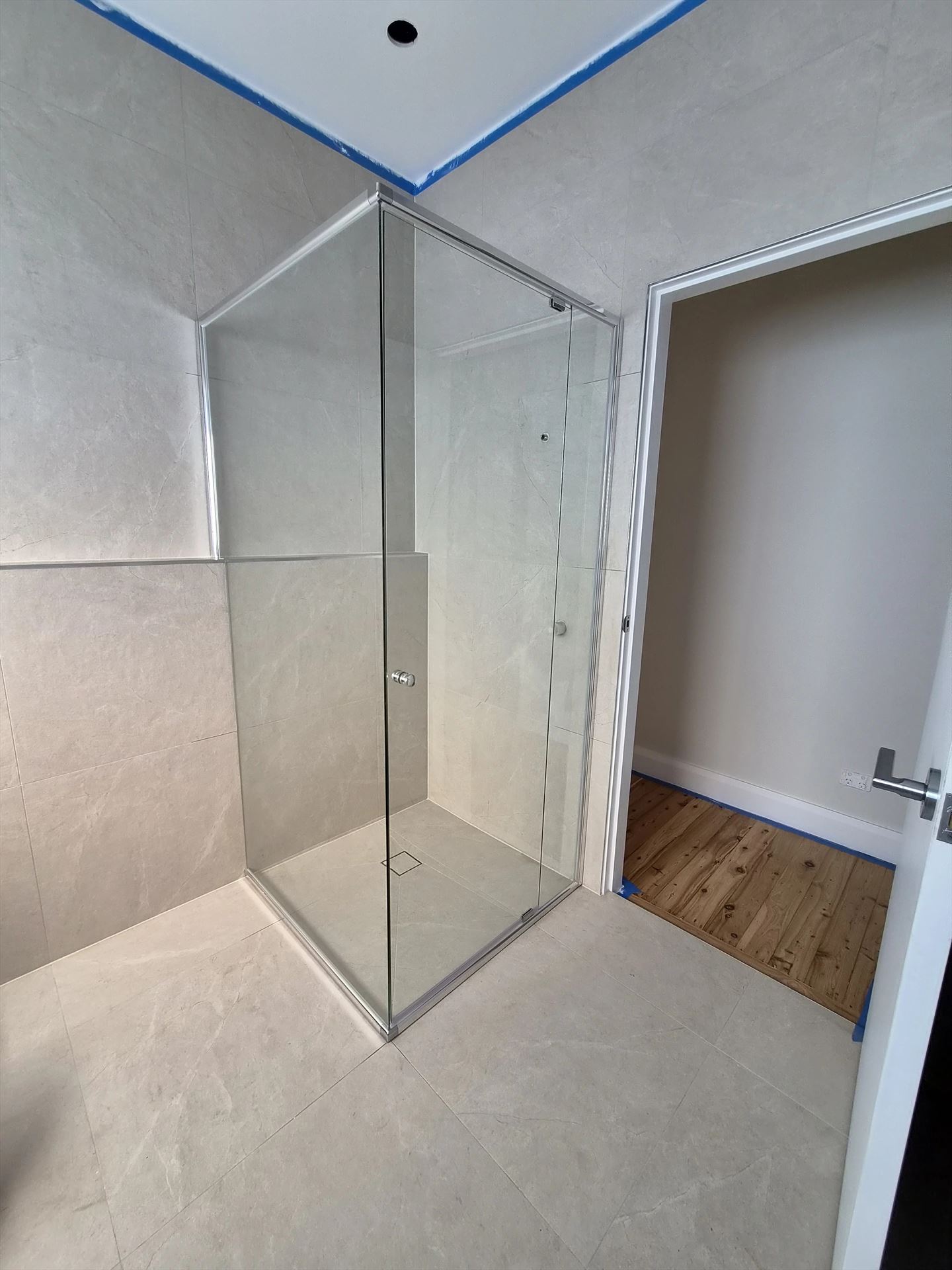 semi shower screen with chrome hardware installed in Seven Hills by Showerland