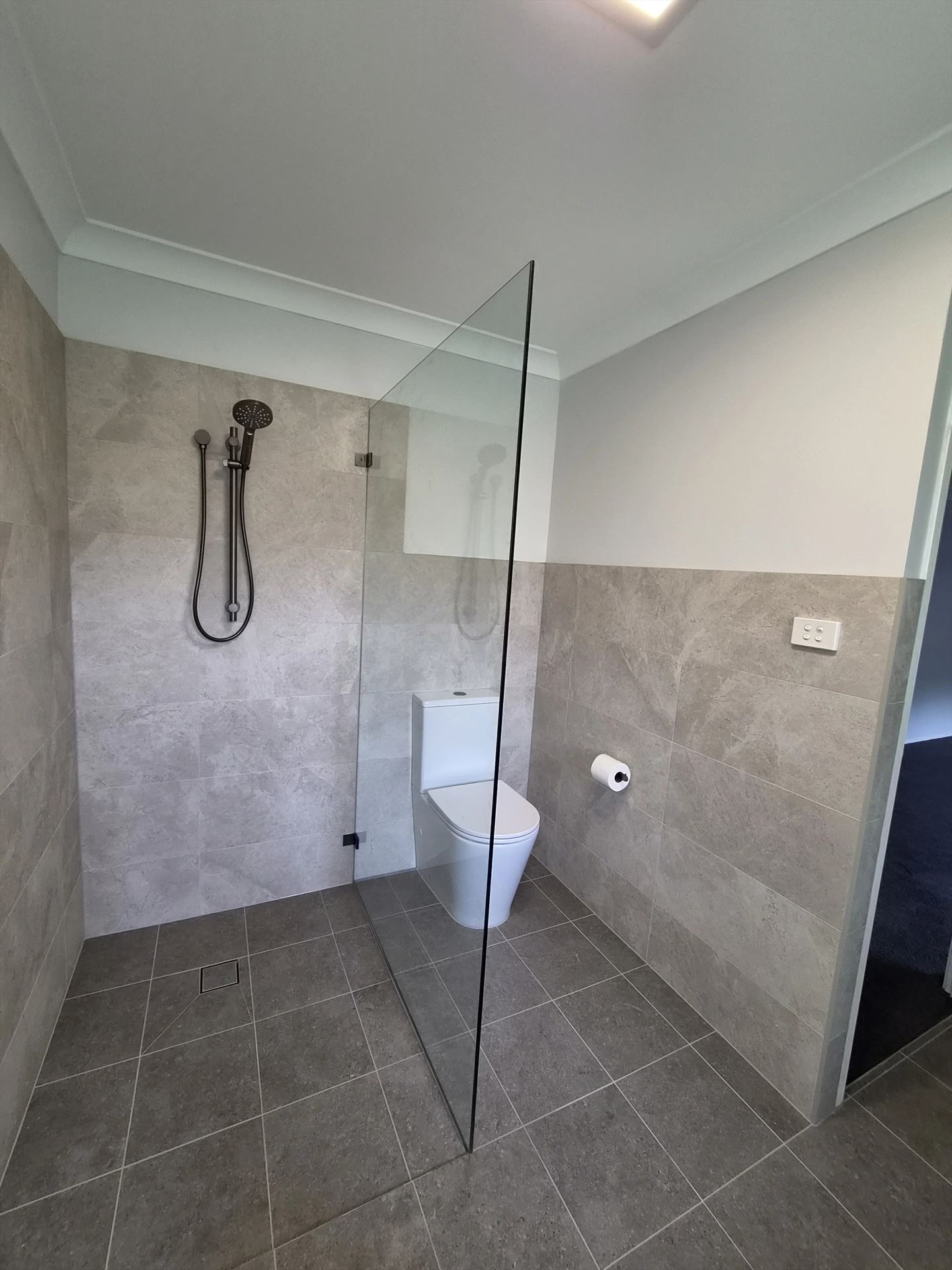 frameless shower screen with chrome hardware installed in Heathcote by Showerland