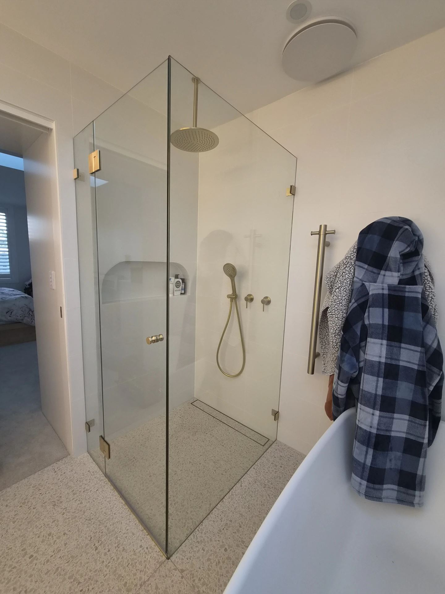 frameless shower screen with gold hardware installed in Beacon Hill by Showerland