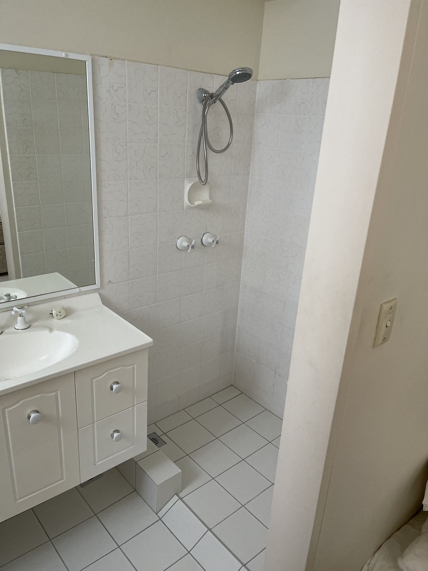 Bathroom before frameless shower screen install in Manly