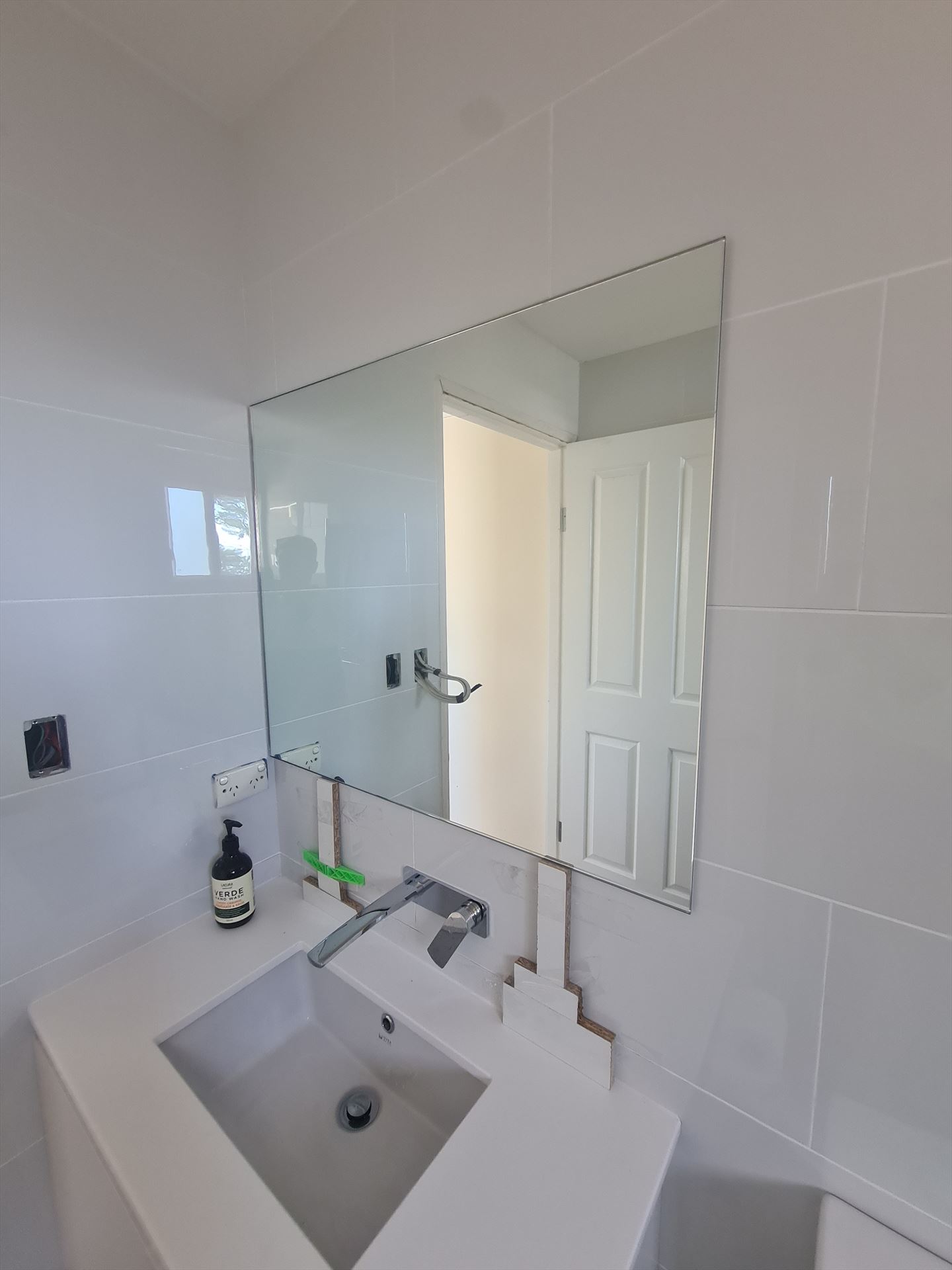 Bathroom before frameless shower screen install in Ryde