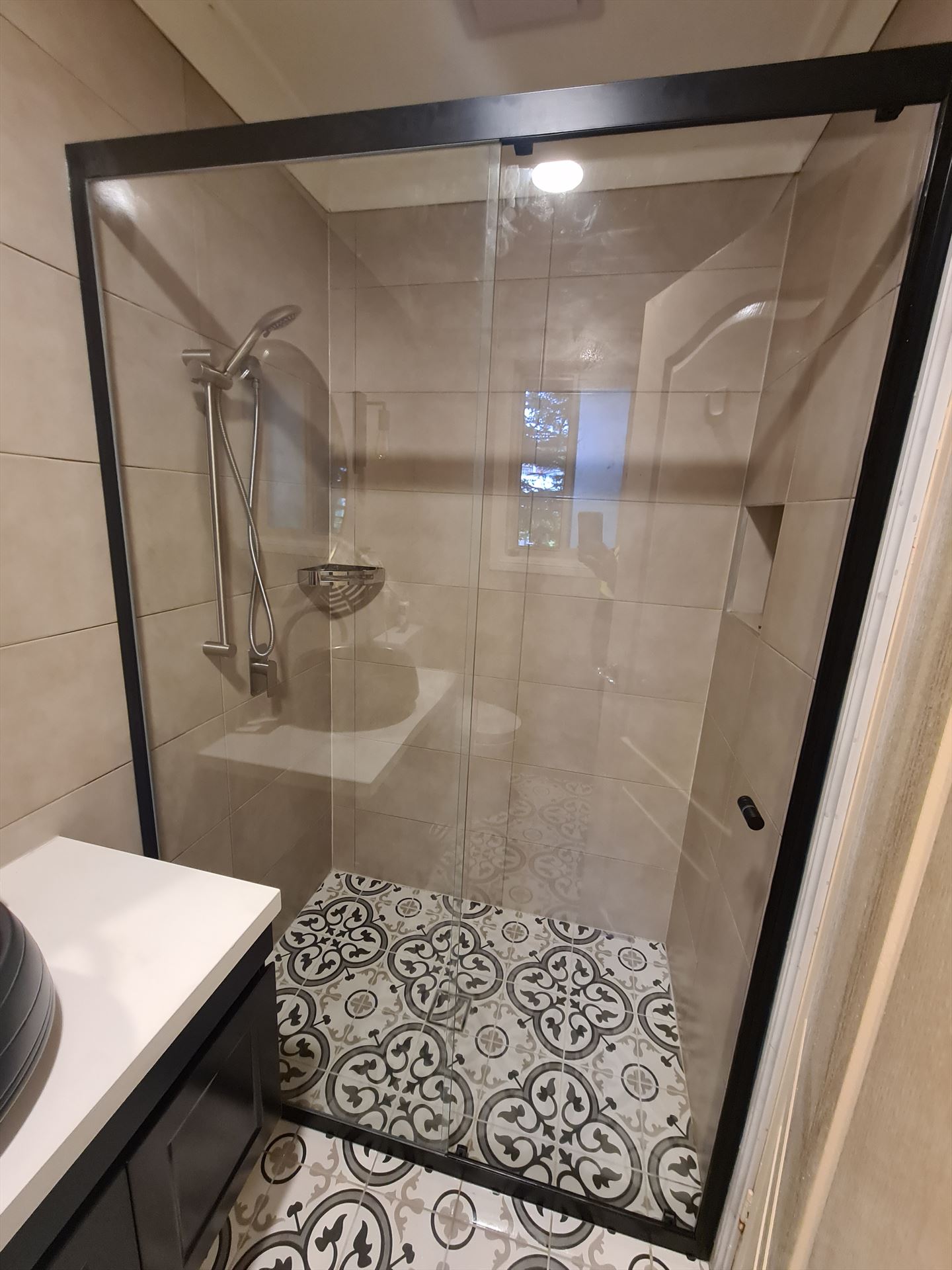 semi shower screen with black hardware installed in Hornsby by Showerland