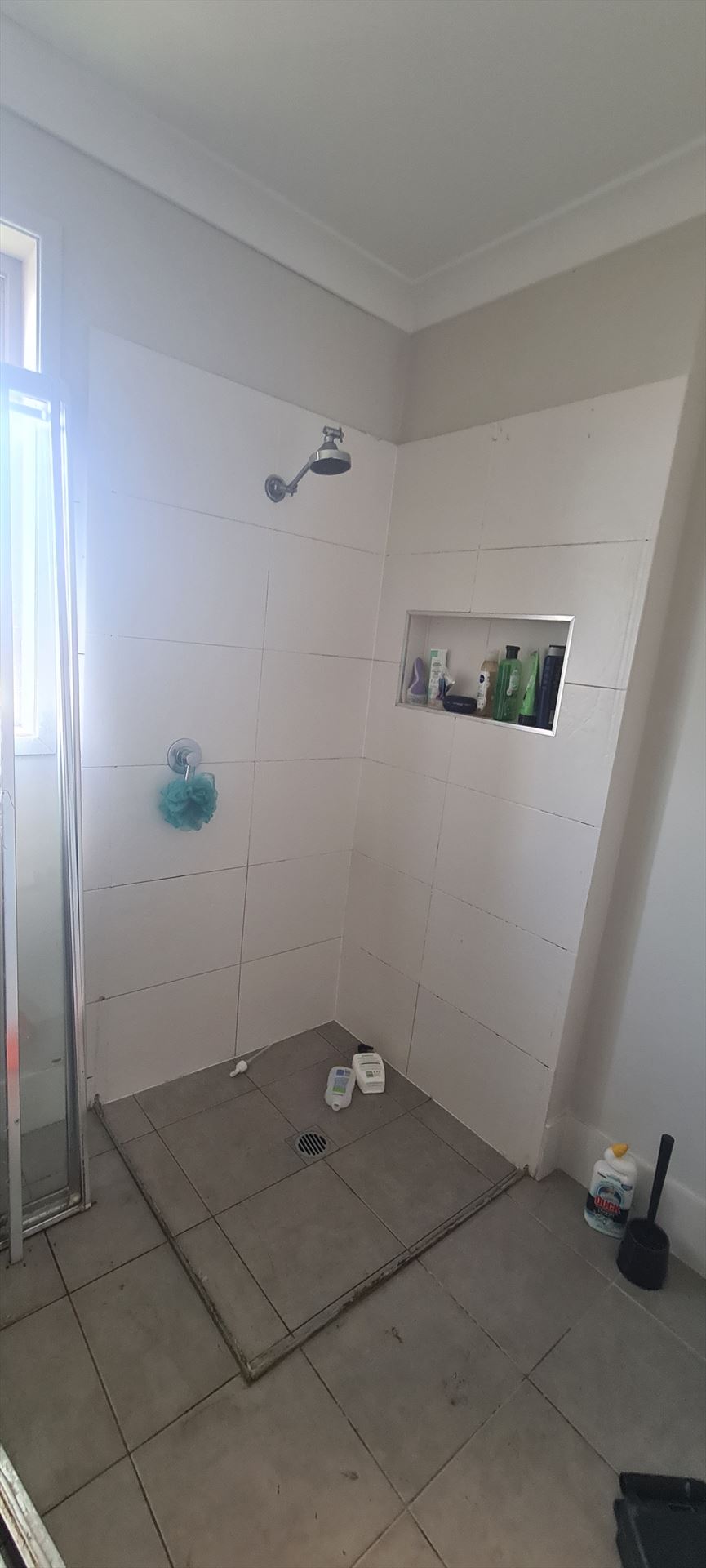 Bathroom before frameless shower screen install in The Ponds