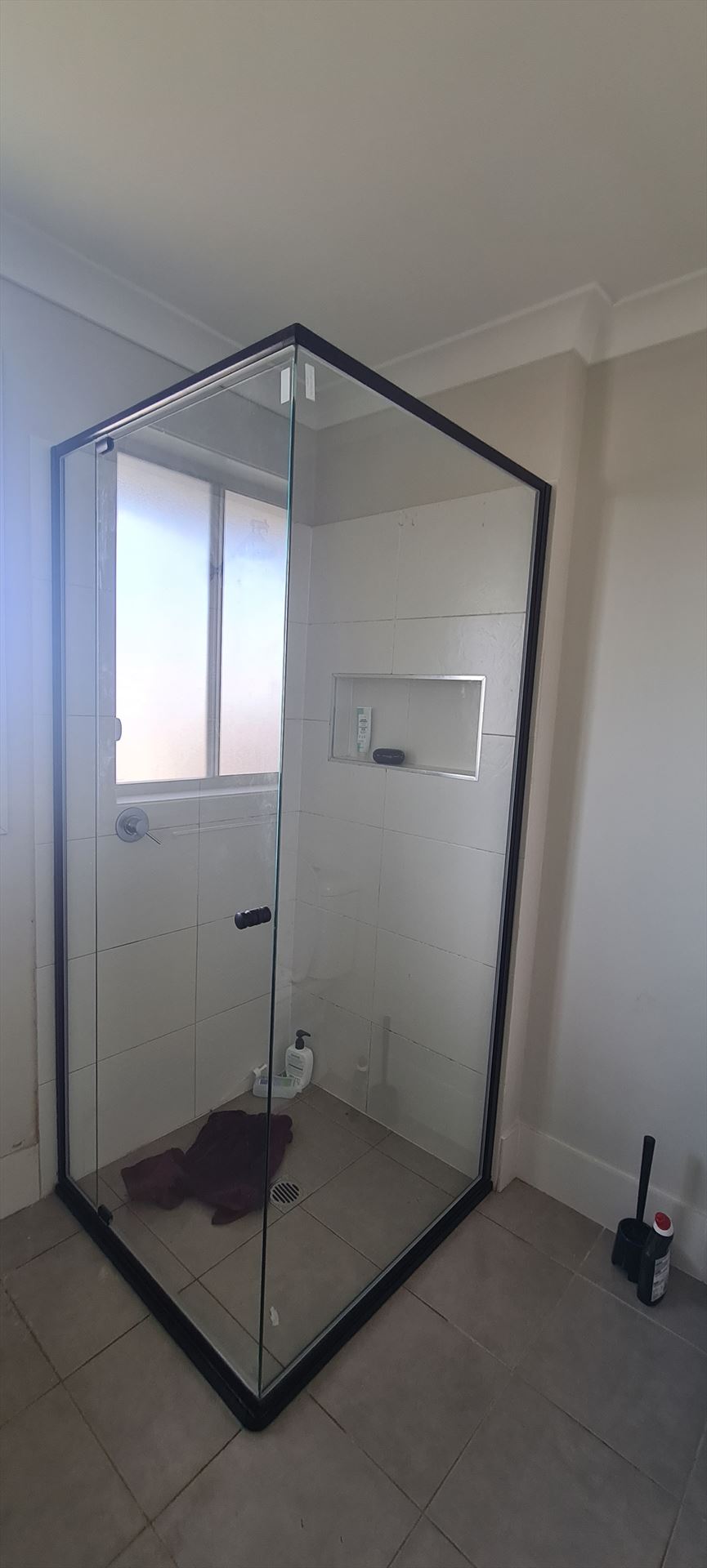 semi shower screen with black hardware installed in The Ponds by Showerland