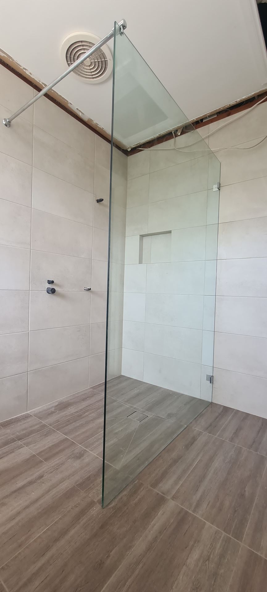 shower screen with chrome hardware installed in Castle Hill by Showerland
