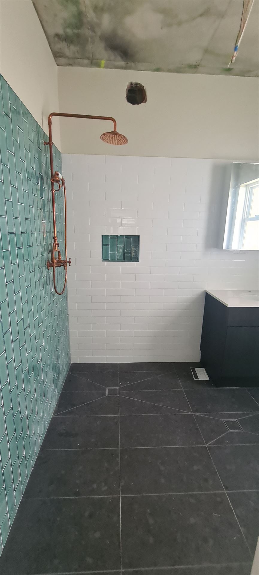 Bathroom before frameless shower screen install in Ashbury