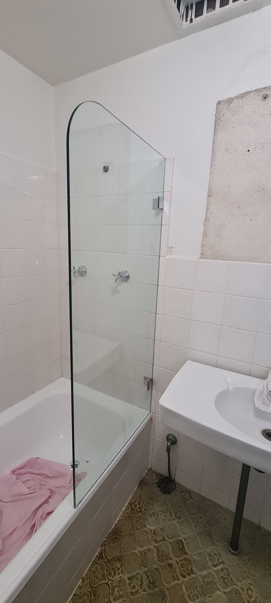 frameless shower screen with chrome hardware installed in Elizabeth Bay by Showerland