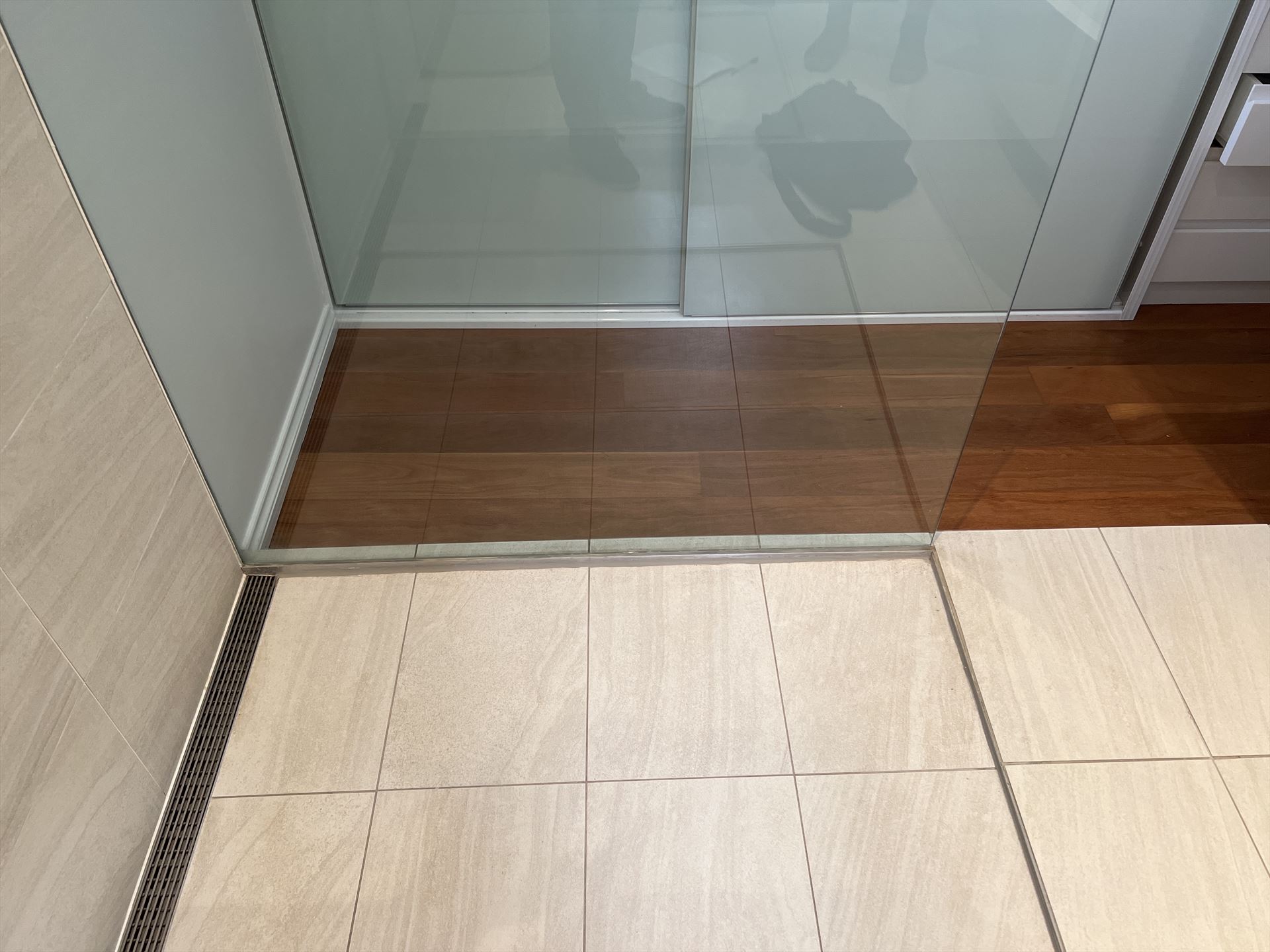 shower screen with chrome hardware installed in Lilyfield by Showerland