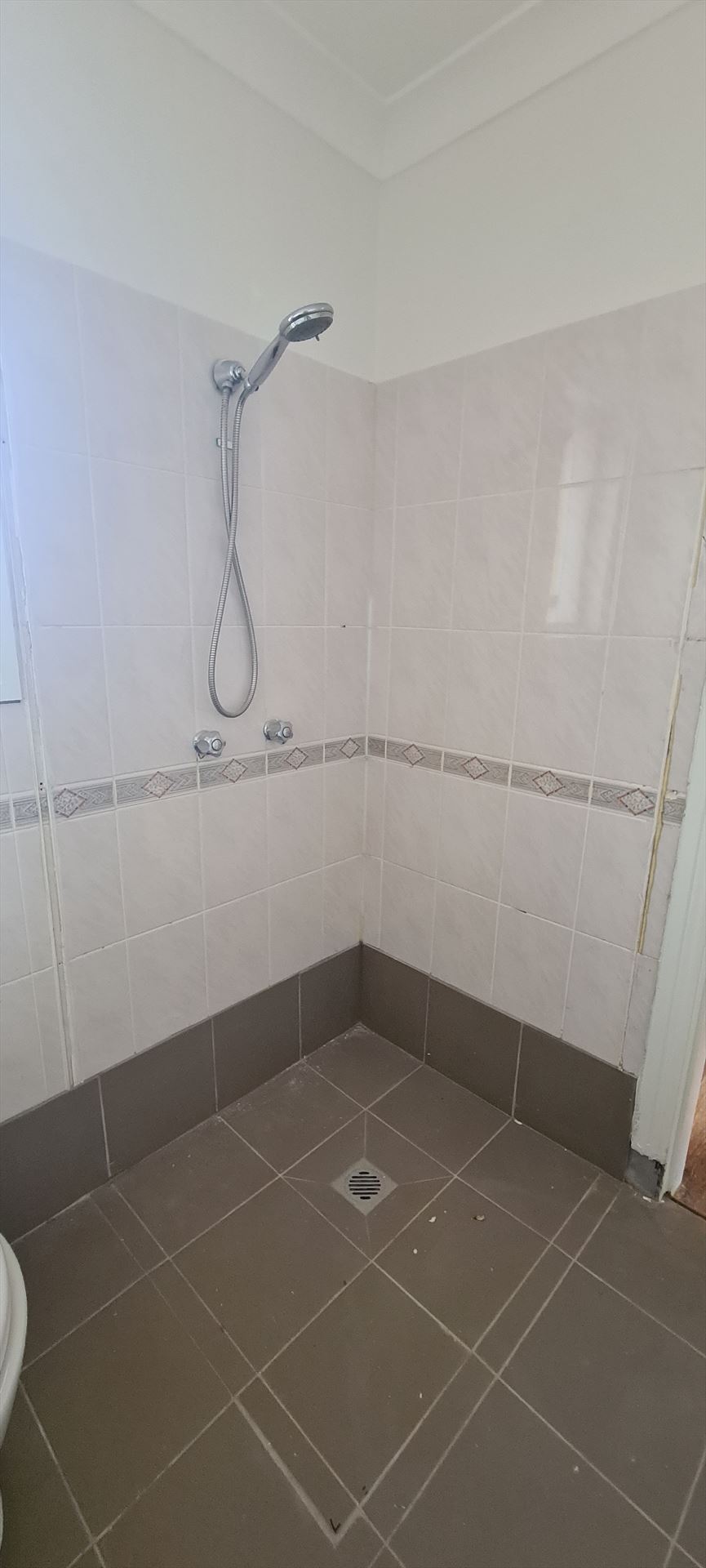 Bathroom before frameless shower screen install in Lidcombe