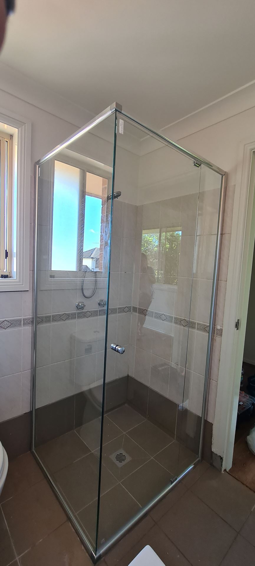 semi shower screen with chrome hardware installed in Lidcombe by Showerland