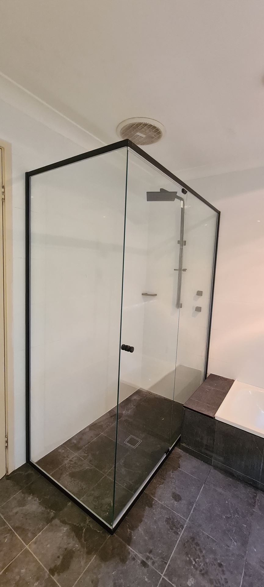 semi shower screen with black hardware installed in Mount Colah by Showerland