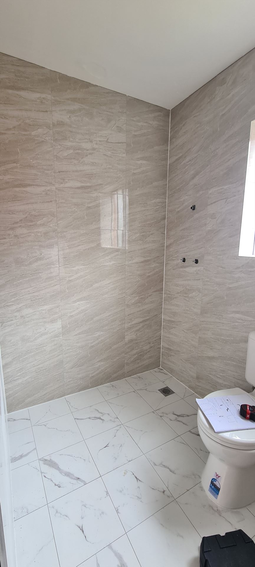 Bathroom before frameless shower screen install in Auburn