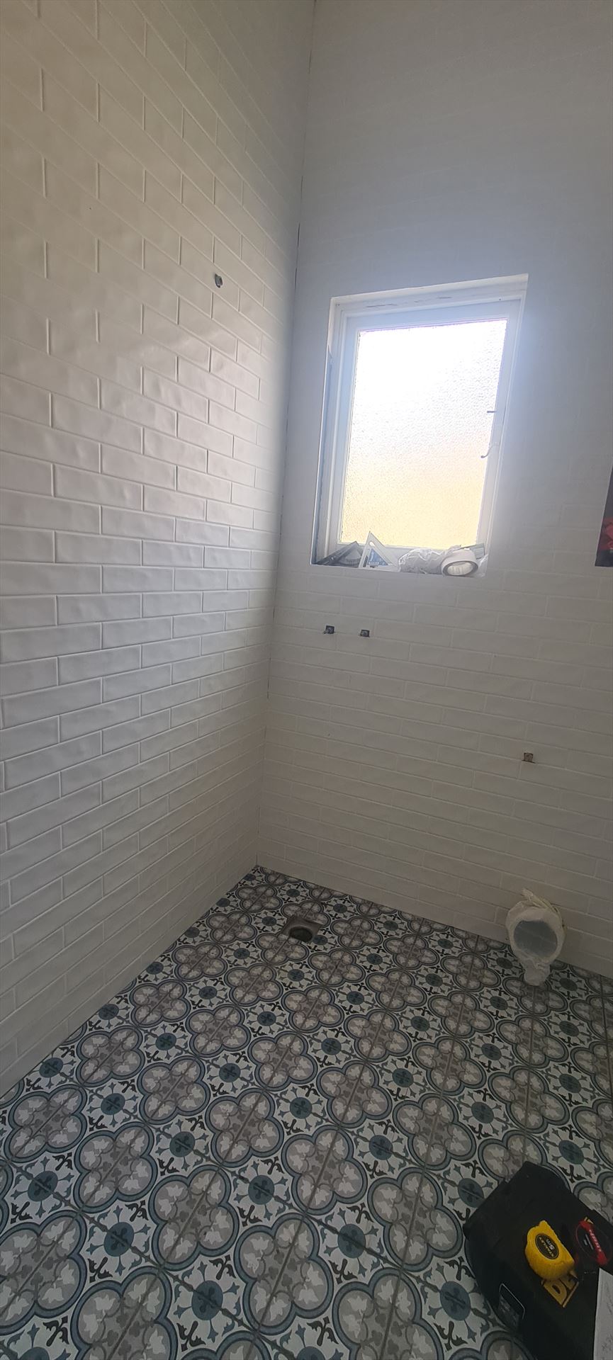Bathroom before frameless shower screen install in Ashbury
