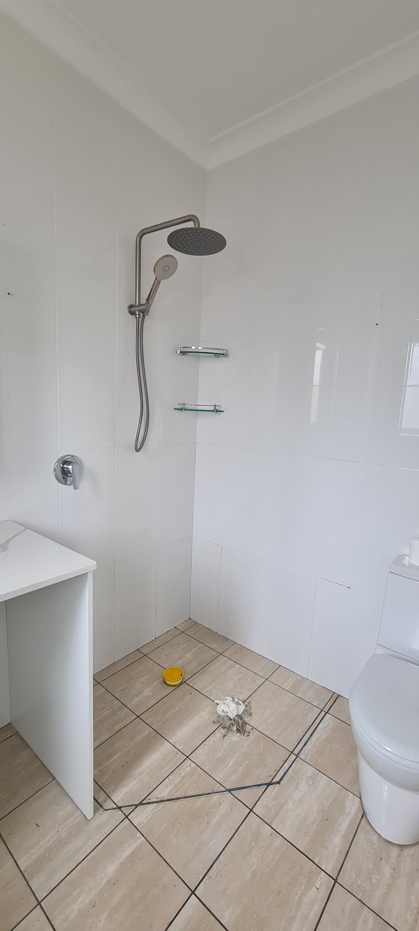 Bathroom before frameless shower screen install in Strathfield